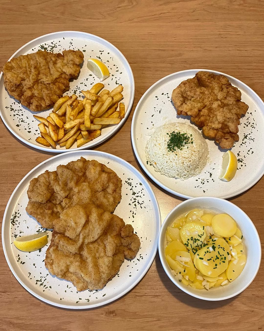 two glass of iced tea with some orange fruit around them