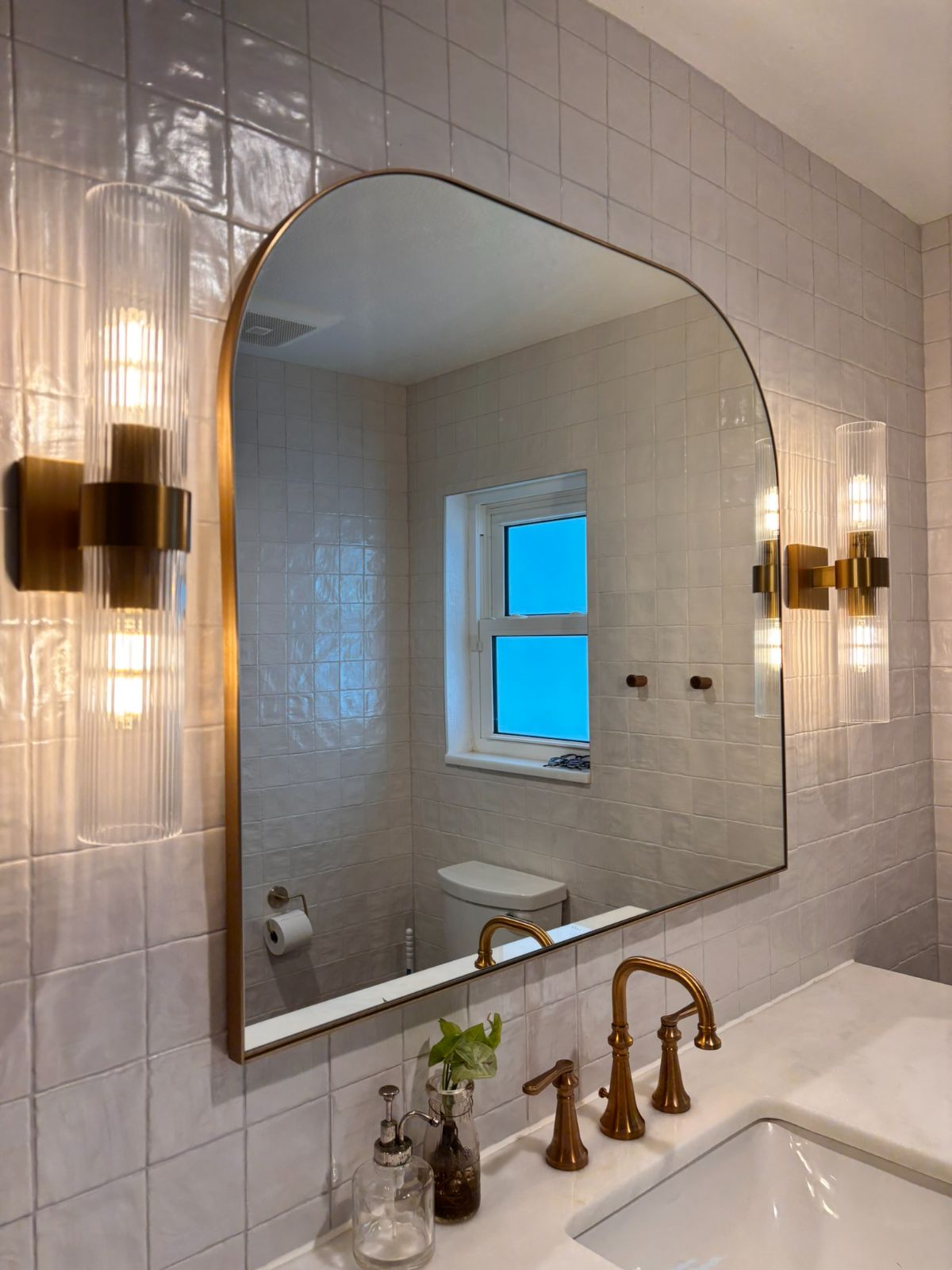 Brushed gold faucet on marble