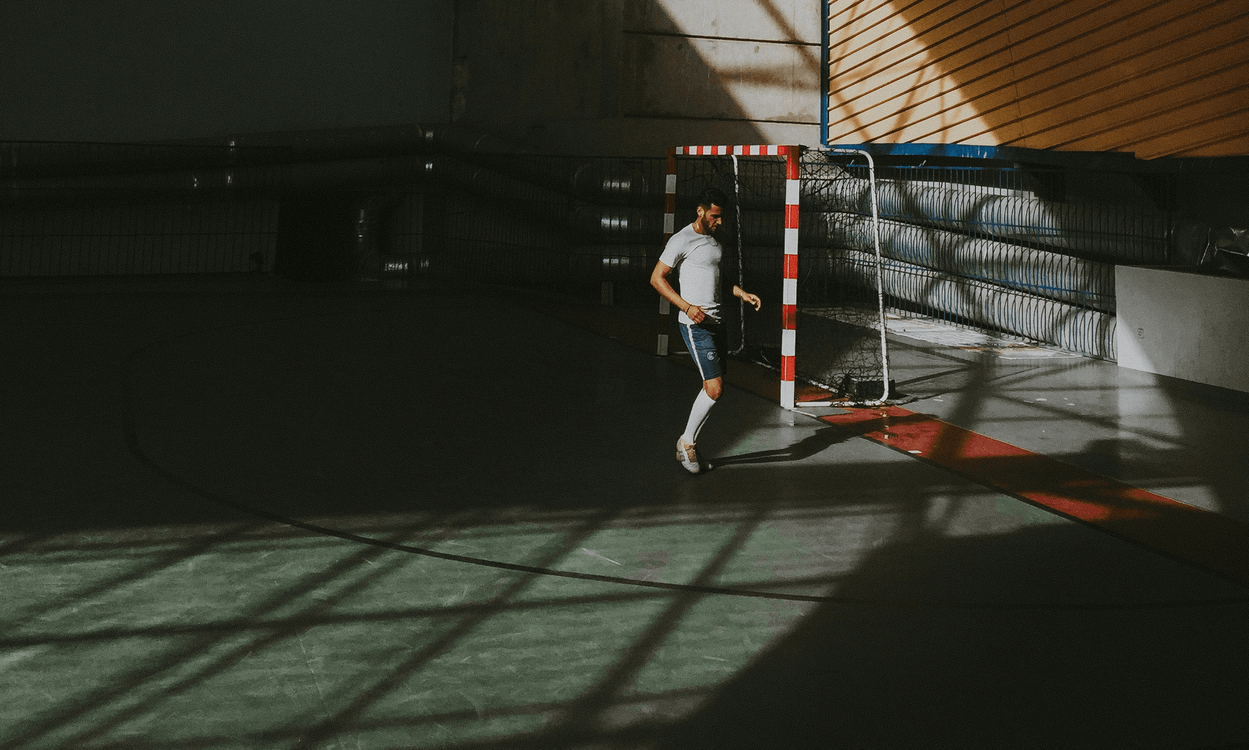 Indoor soccer field with lone player