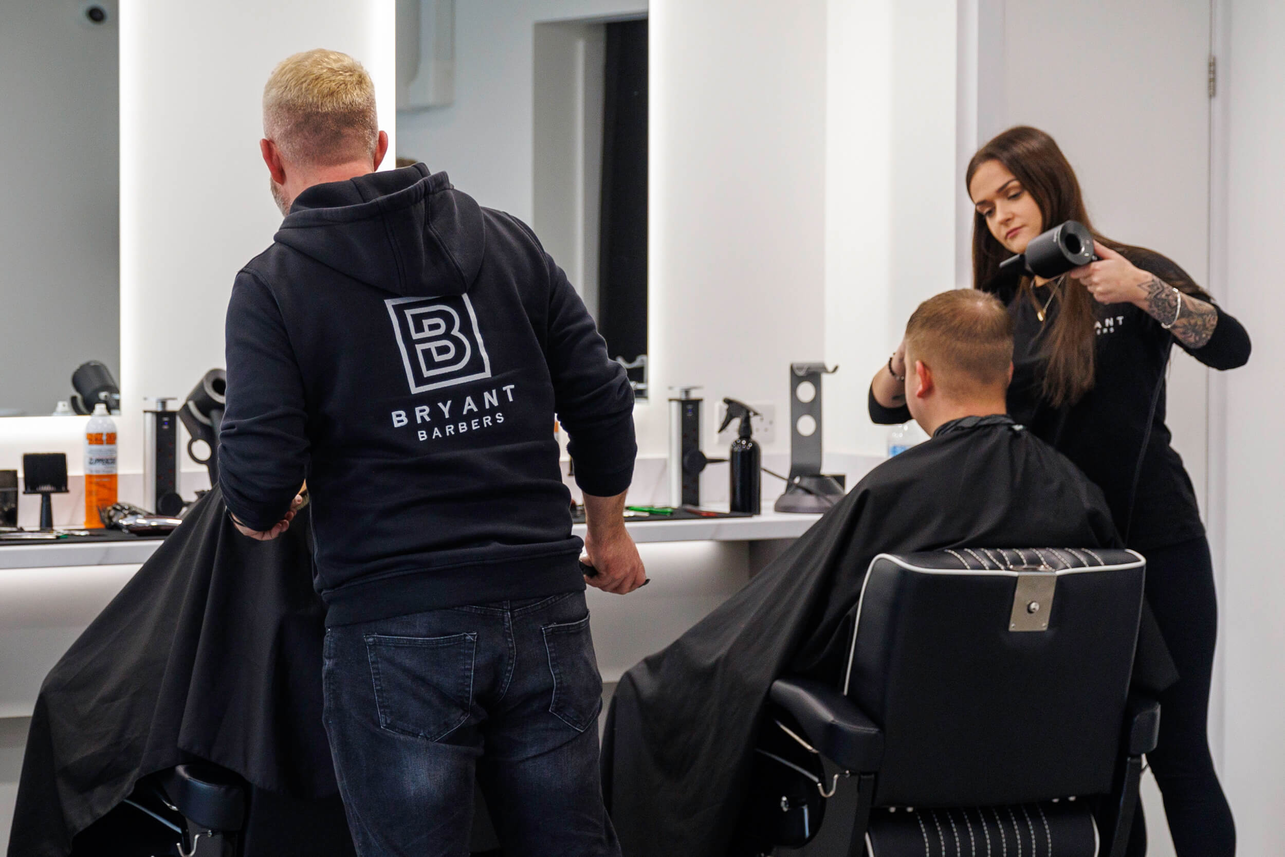 Mollie and Dan working at Bryant Barbers