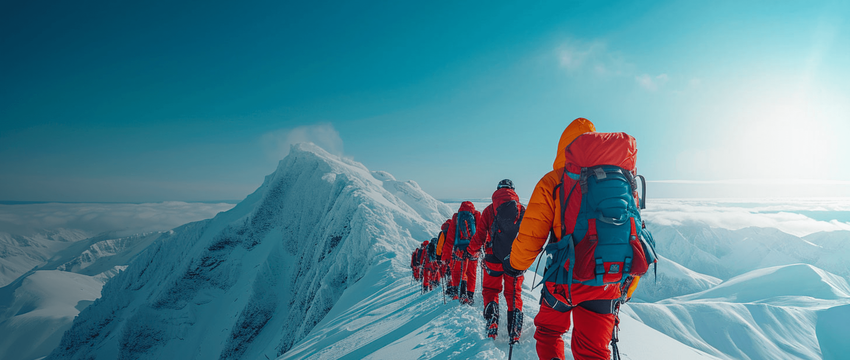 Ice climbers walking on top of an icy mountain