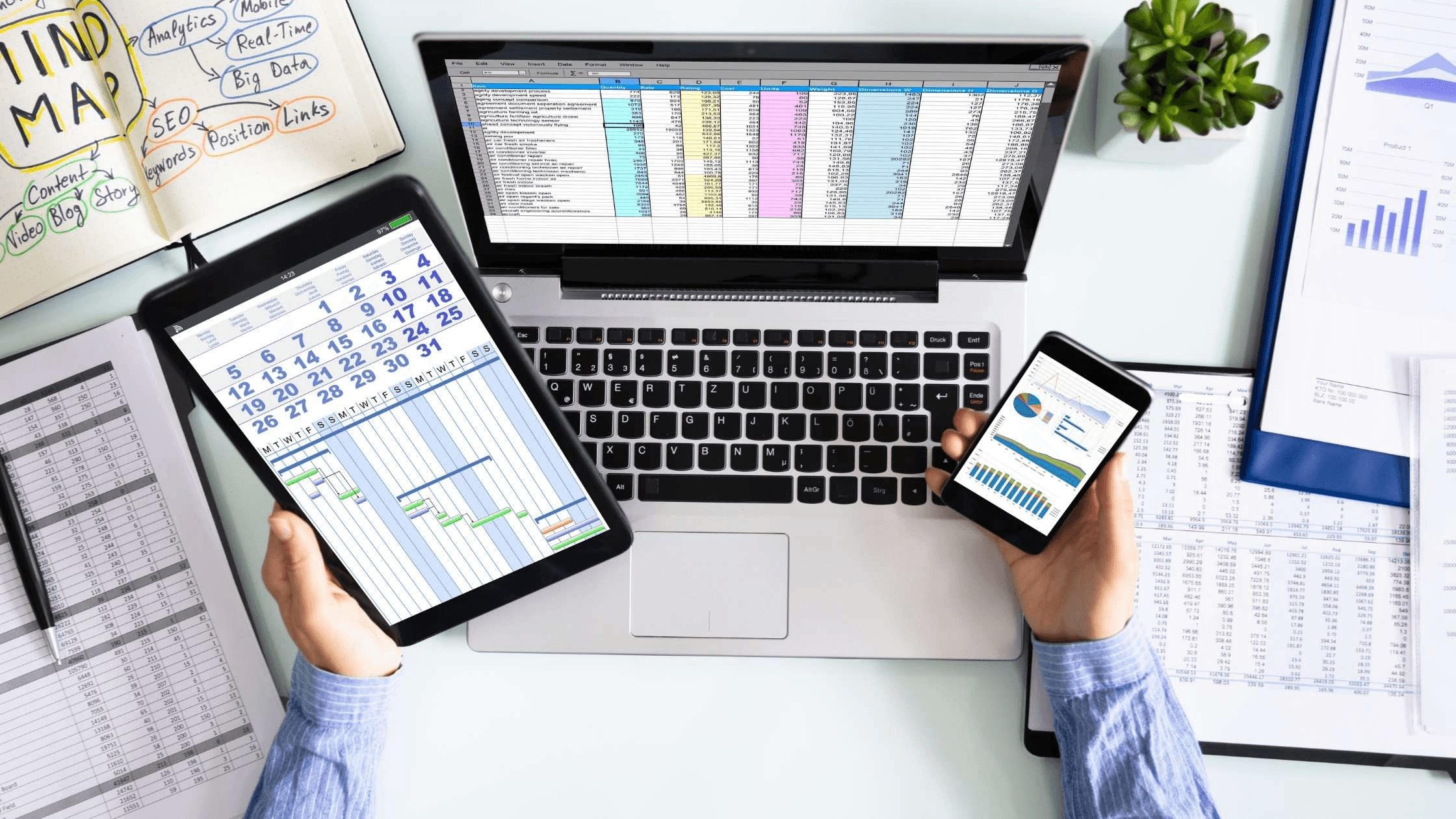 Person using multiple digital business devices -  How to Find Duplicates in Google Sheets