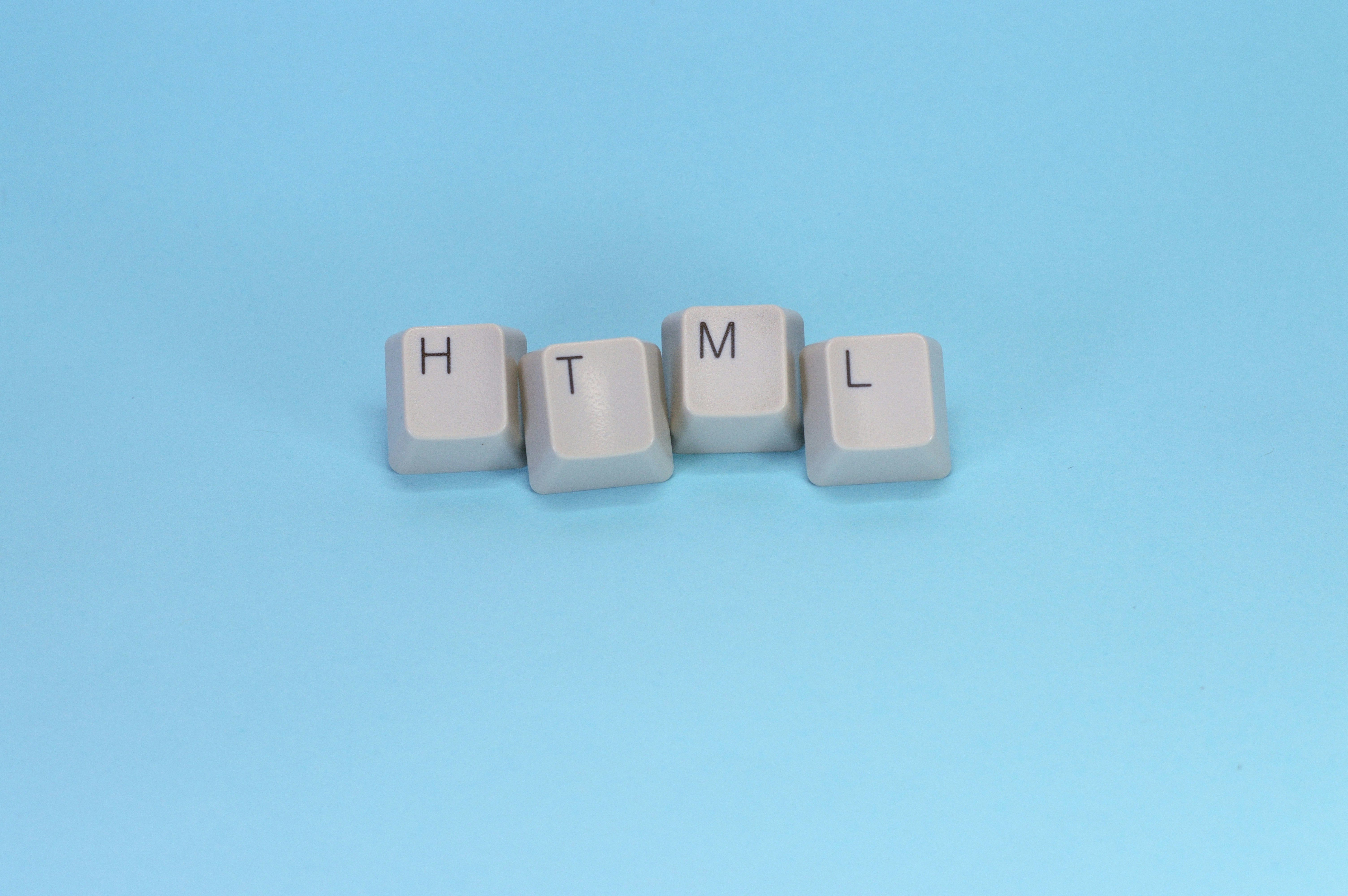 Html spelled out with keyboard keys.