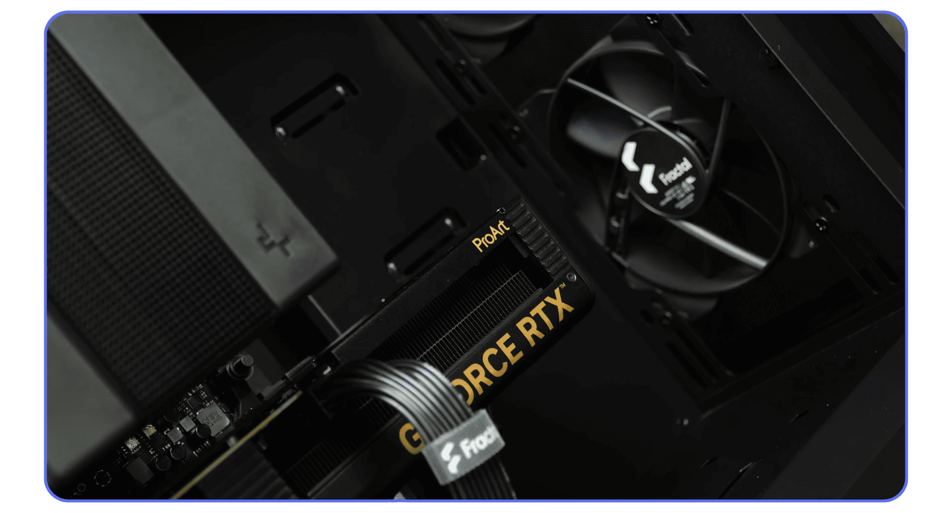 Close-up view of a desktop PC with an NVIDIA GeForce RTX graphics card and internal cooling fans.