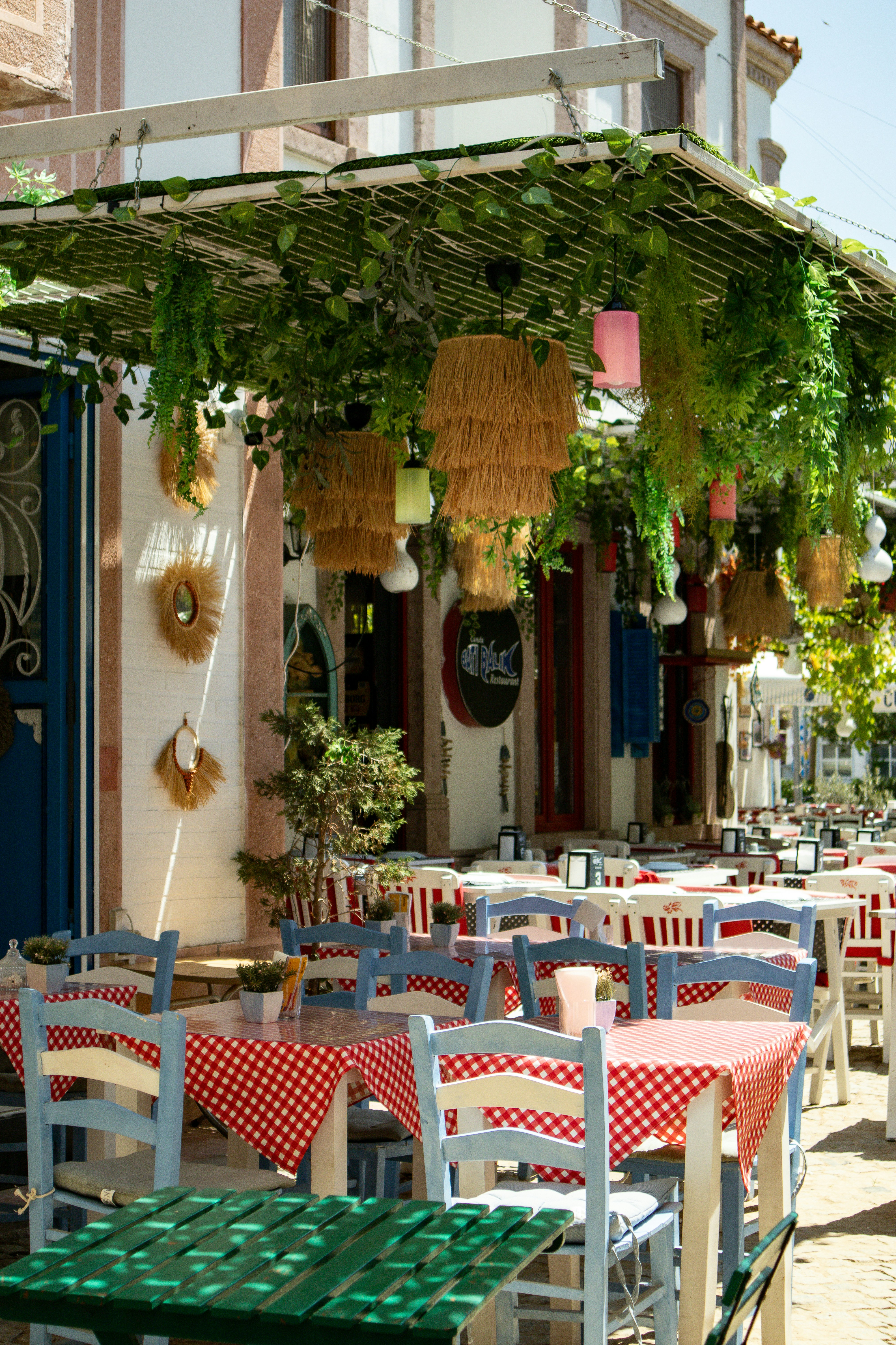 An outdoor dining area with tables and chairs