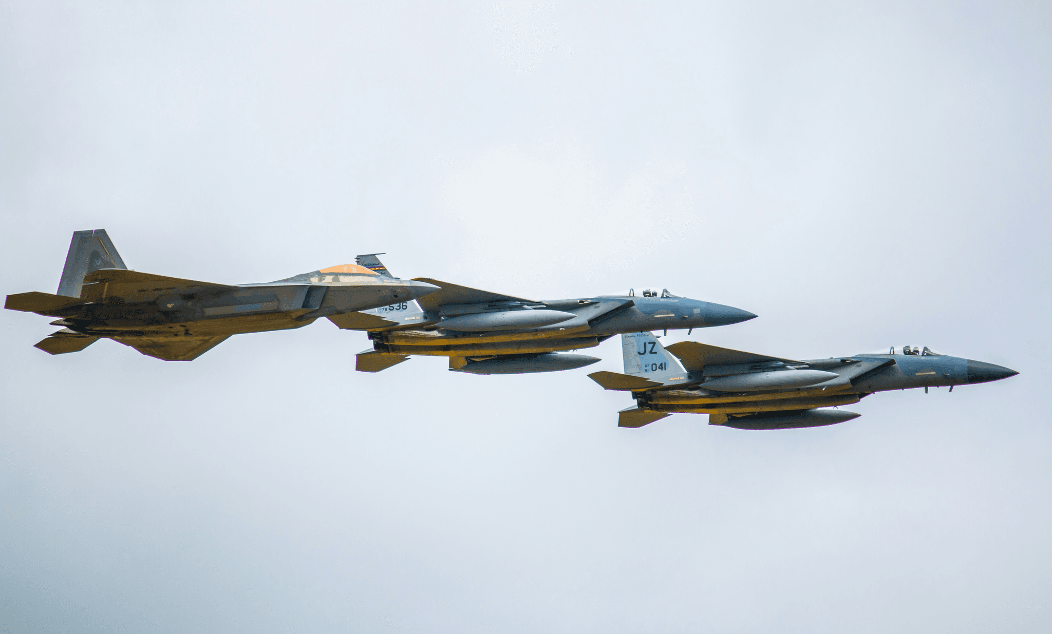 a group of jets fly through the air