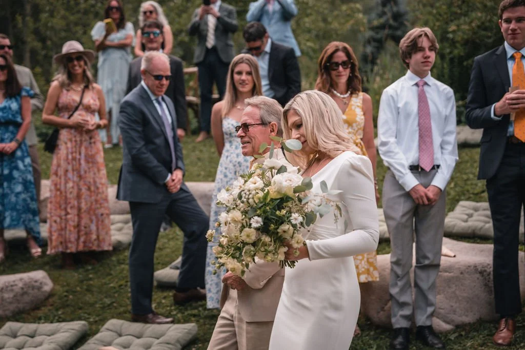 Wedding party walking together after Bosq Aspen wedding