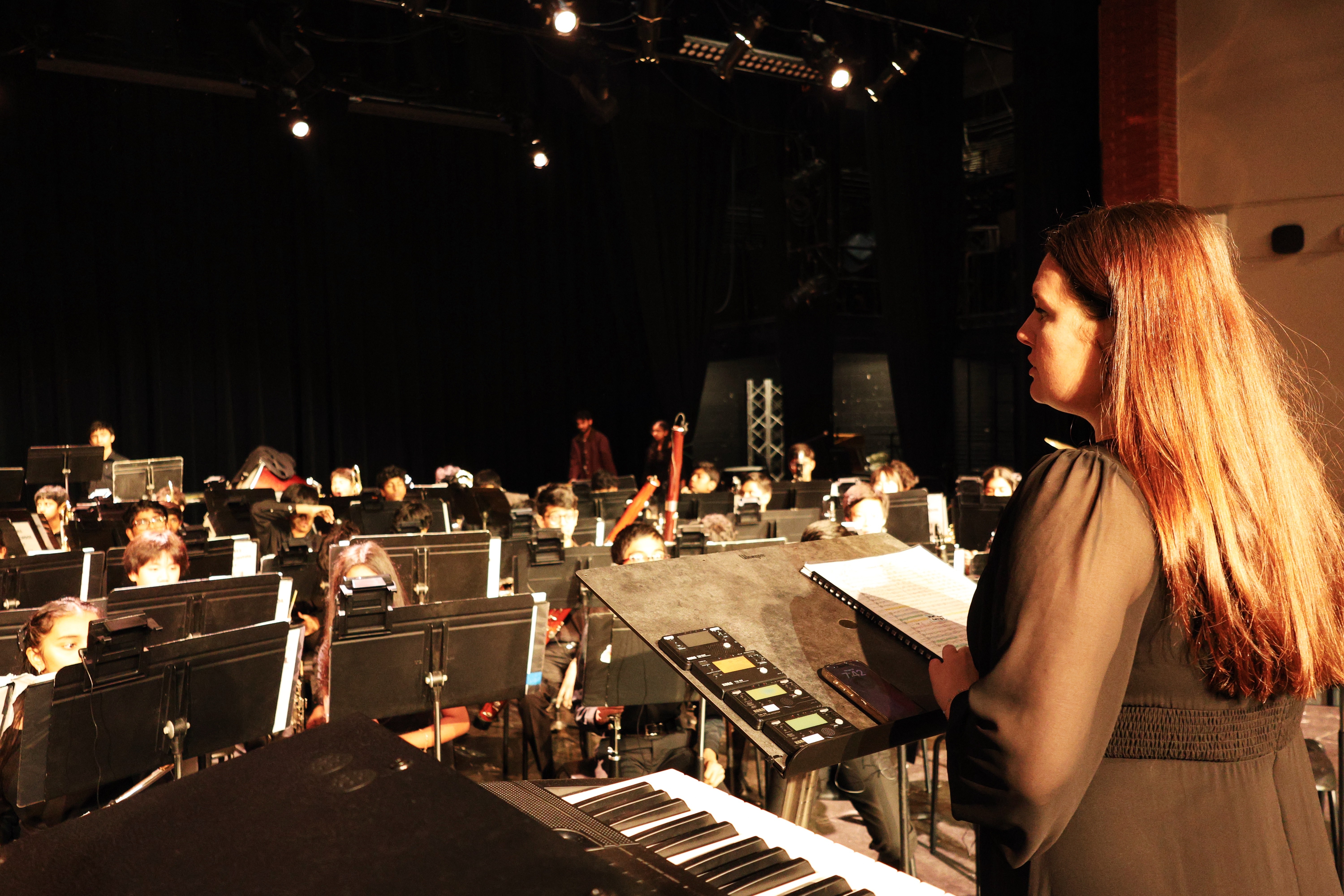 Wide view of director conducting full band