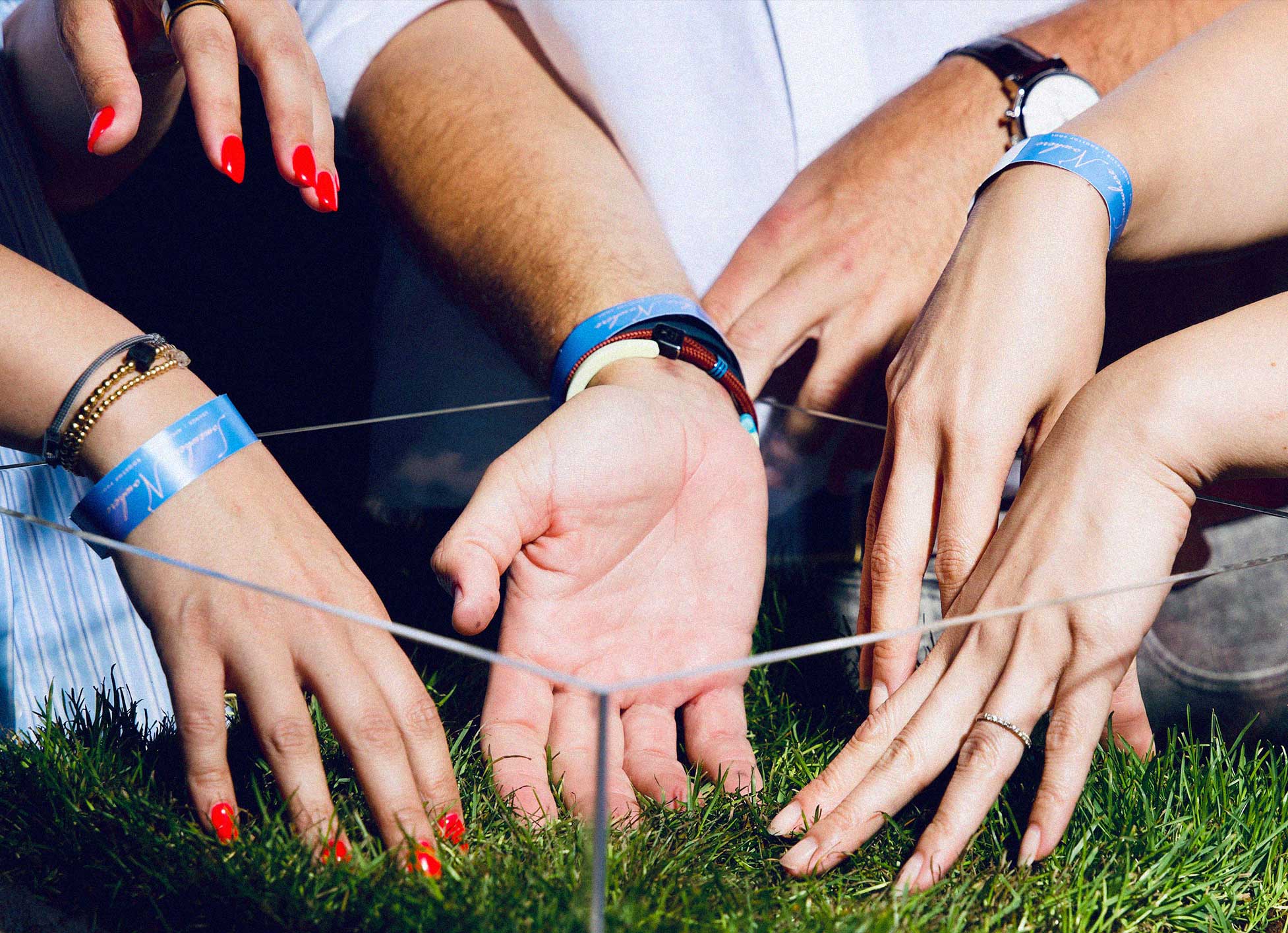 Party guests touch real grass inside the OFFLINE installation.