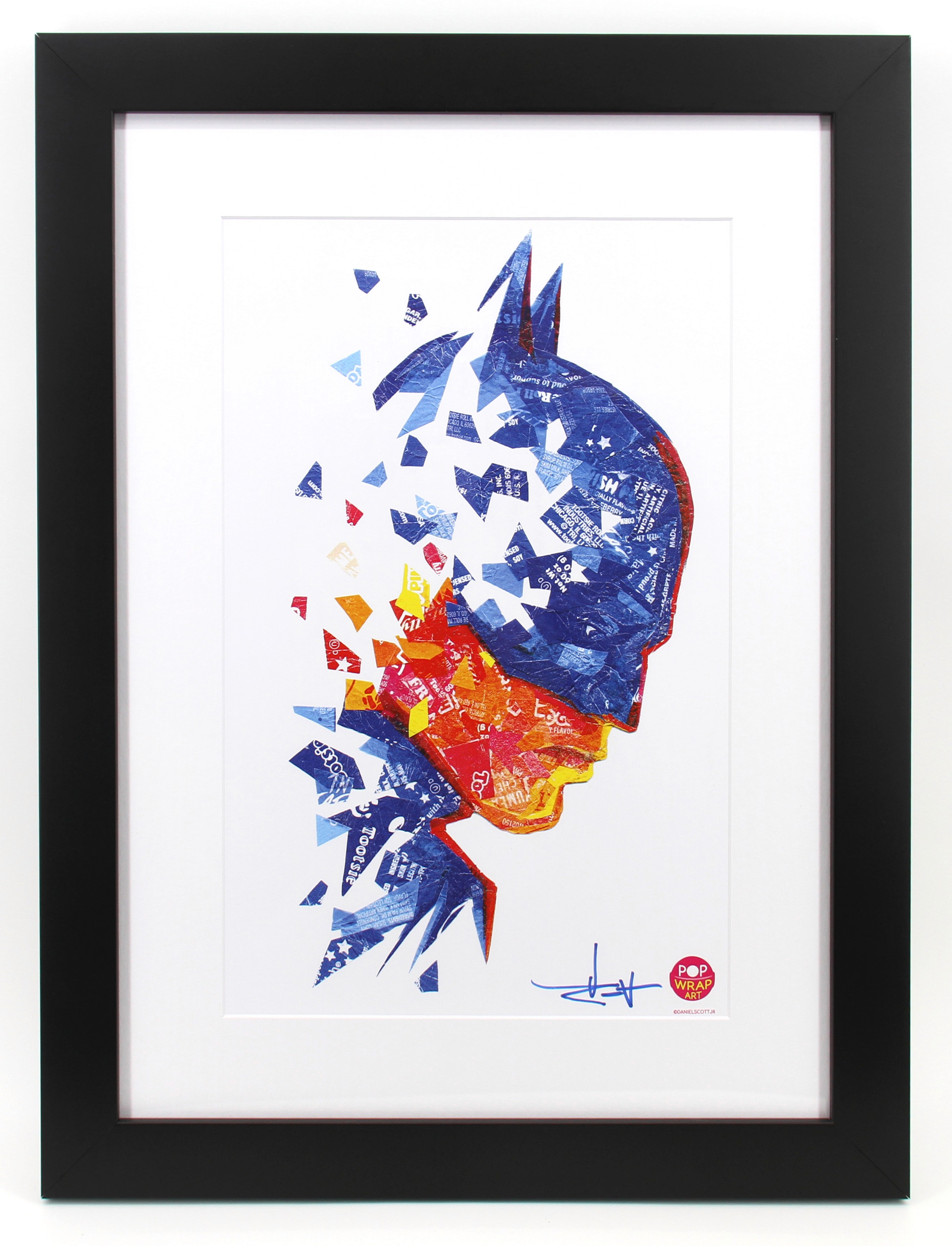 A modern house with large windows and a flat roof, surrounded by greenery against a clear blue sky.