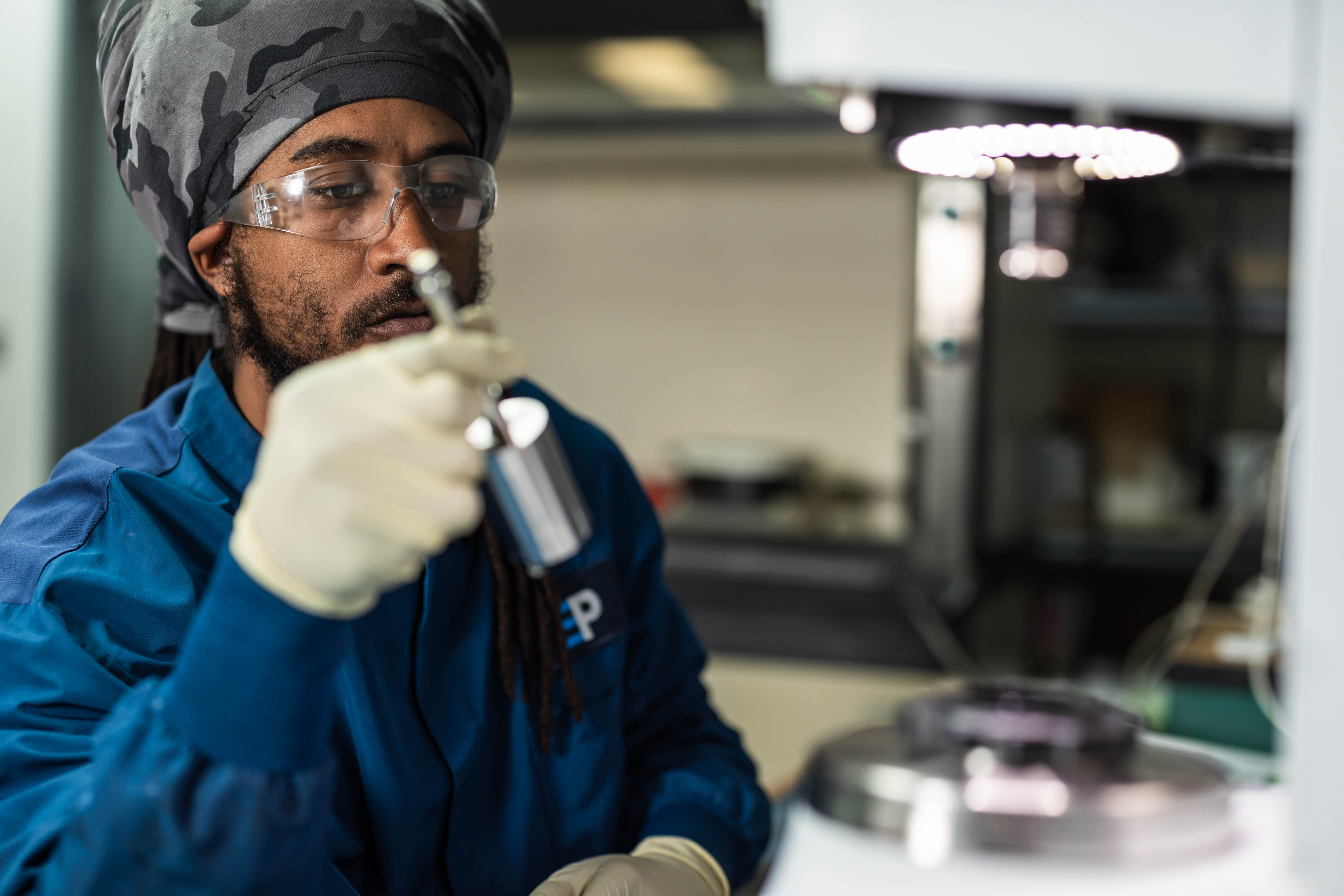 Photo of EnPower Engineer working with precision tools