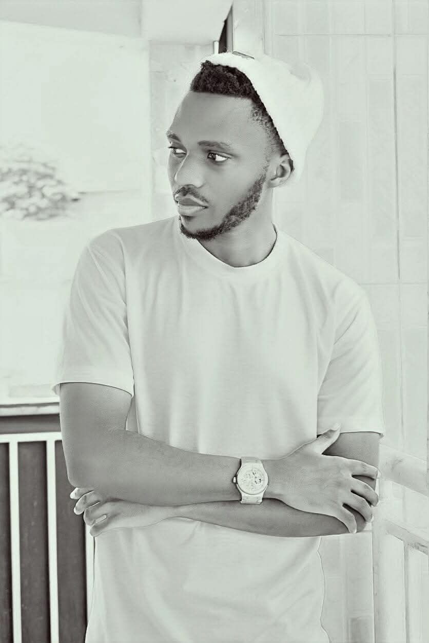 Young woman wearing a green striped outfit and patterned cap, carrying a matching green tote bag in a bright indoor setting with plants.