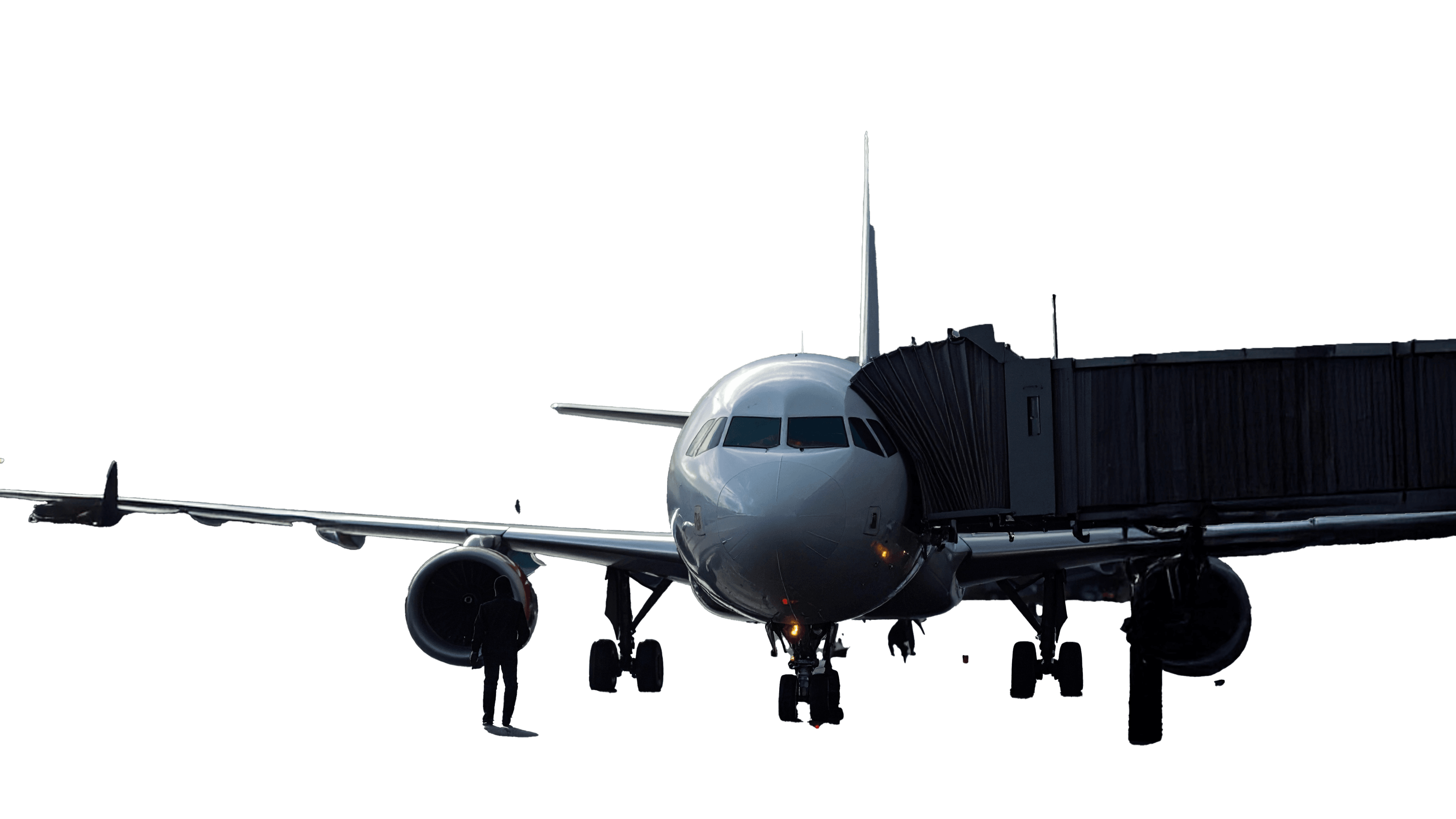 Ein weißes Passagierflugzeug, das an einer Flugzeugschleuse andockt, bereit für den Einstieg.