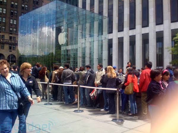 People queuing outside an Apple Store before a product release