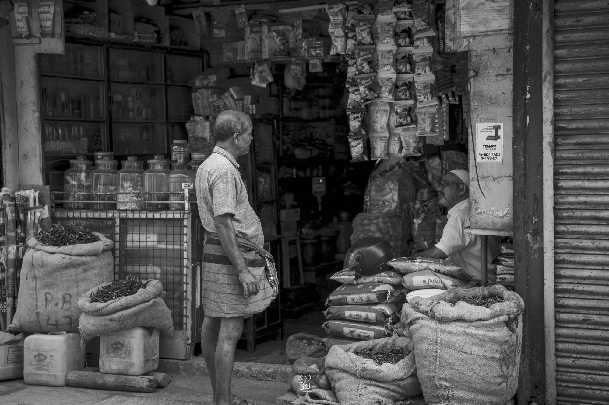 A spice shop with its sacks open to the street