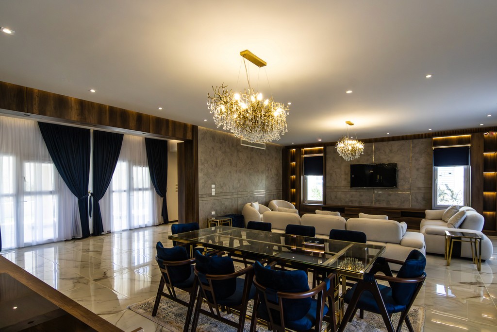 brown wooden house with green grass field