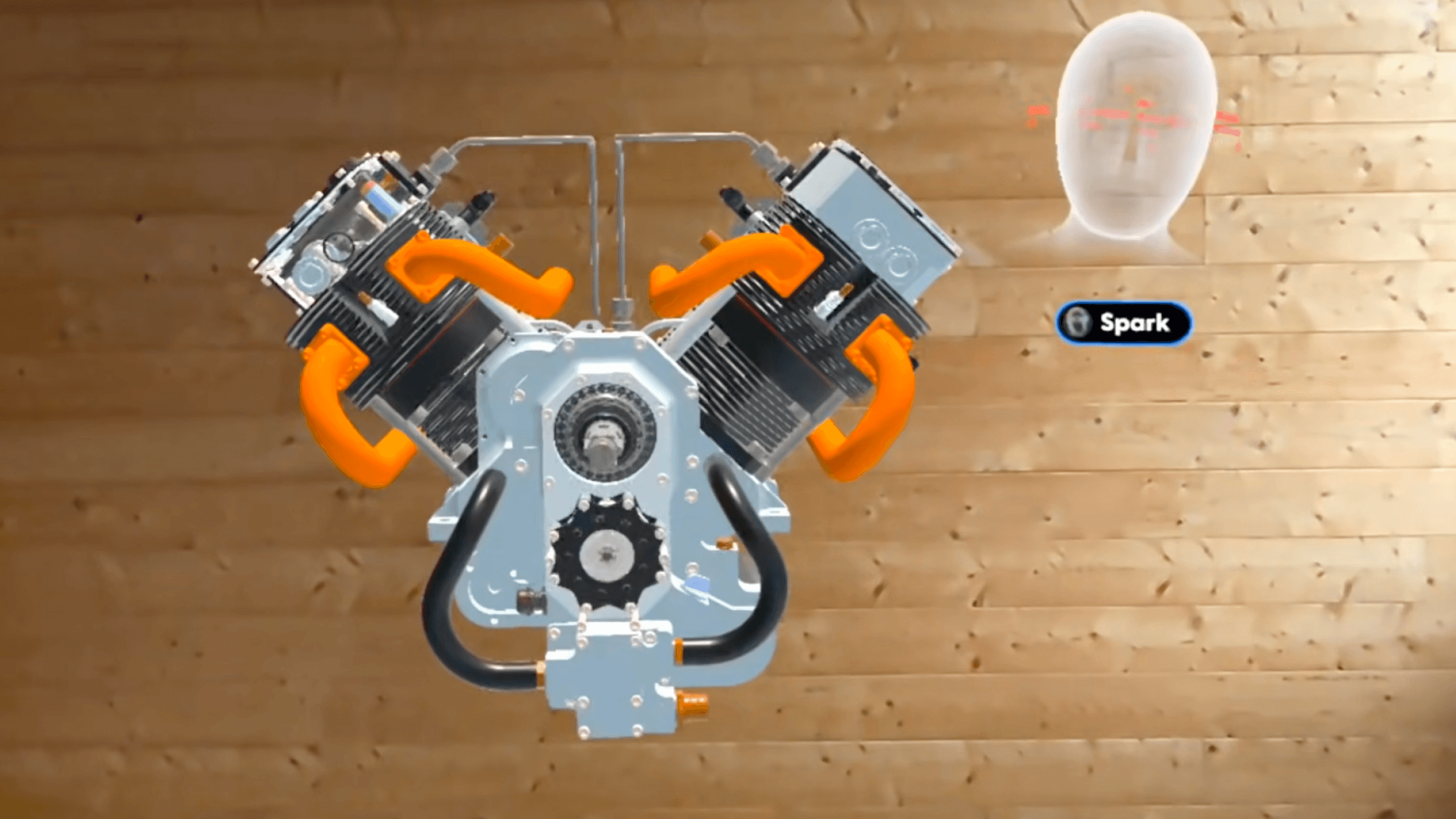 A 3D model of an engine with Campfire's spatial agent, Spark, visible as an avatar beside the model