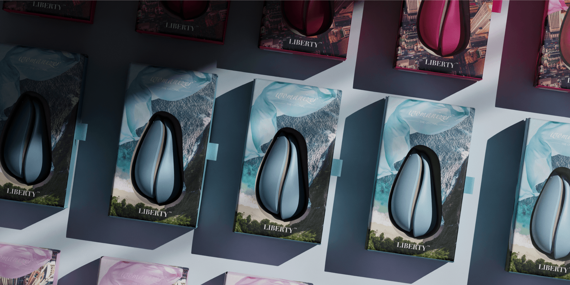 Womanizer „Liberty" Packaging Design – Verpackungs-Sortiment im Raster aufgehängt, mit Editionsmotiven aus Meer, Küste und Stadt in Türkis, Blau und Magenta.