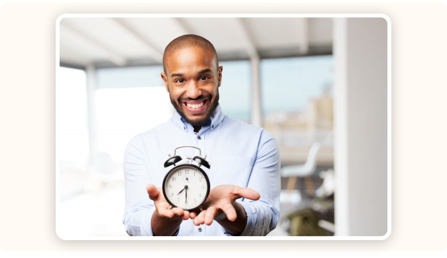 Man holding a clock — symbol of saved time through automation