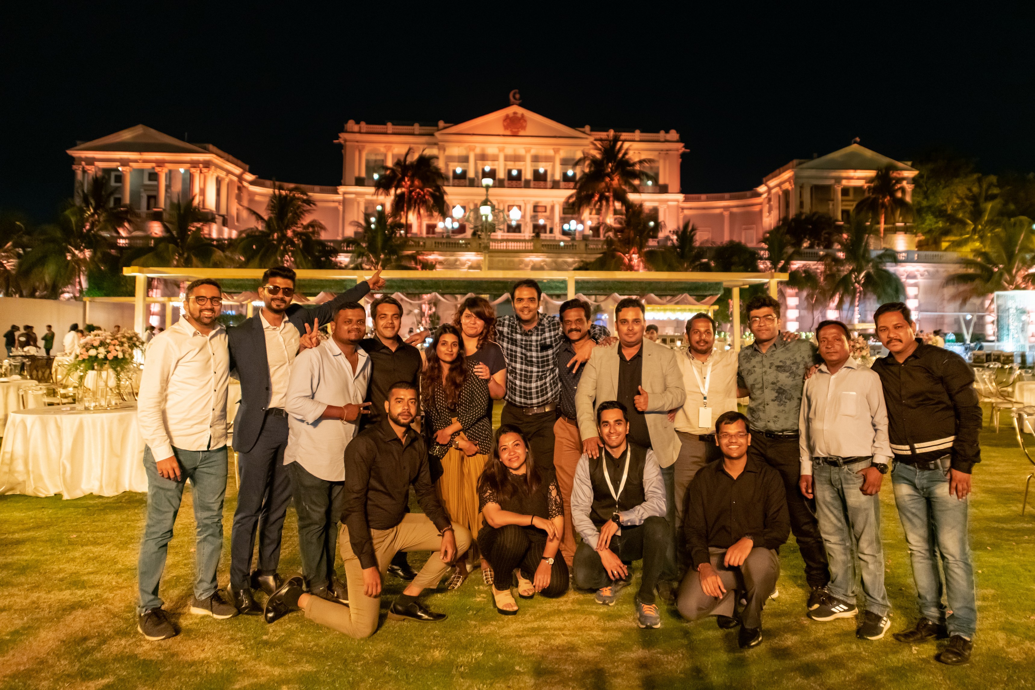 Man in apron stands in rustic kitchen, hands dusted with flour.