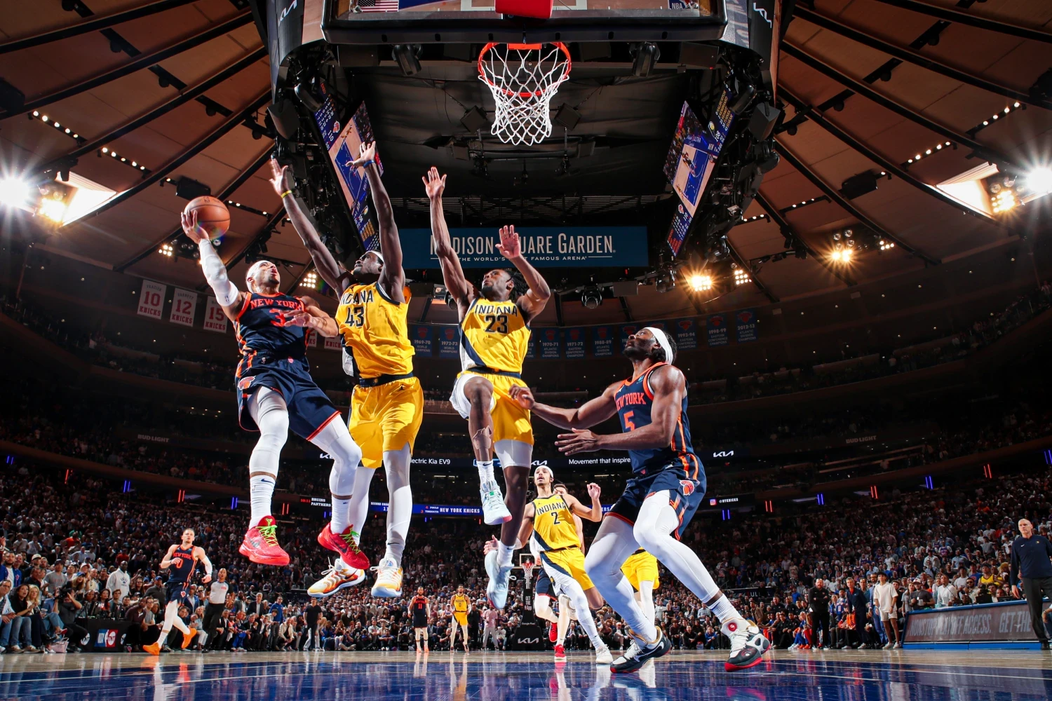 NBA players competing beneath the basket