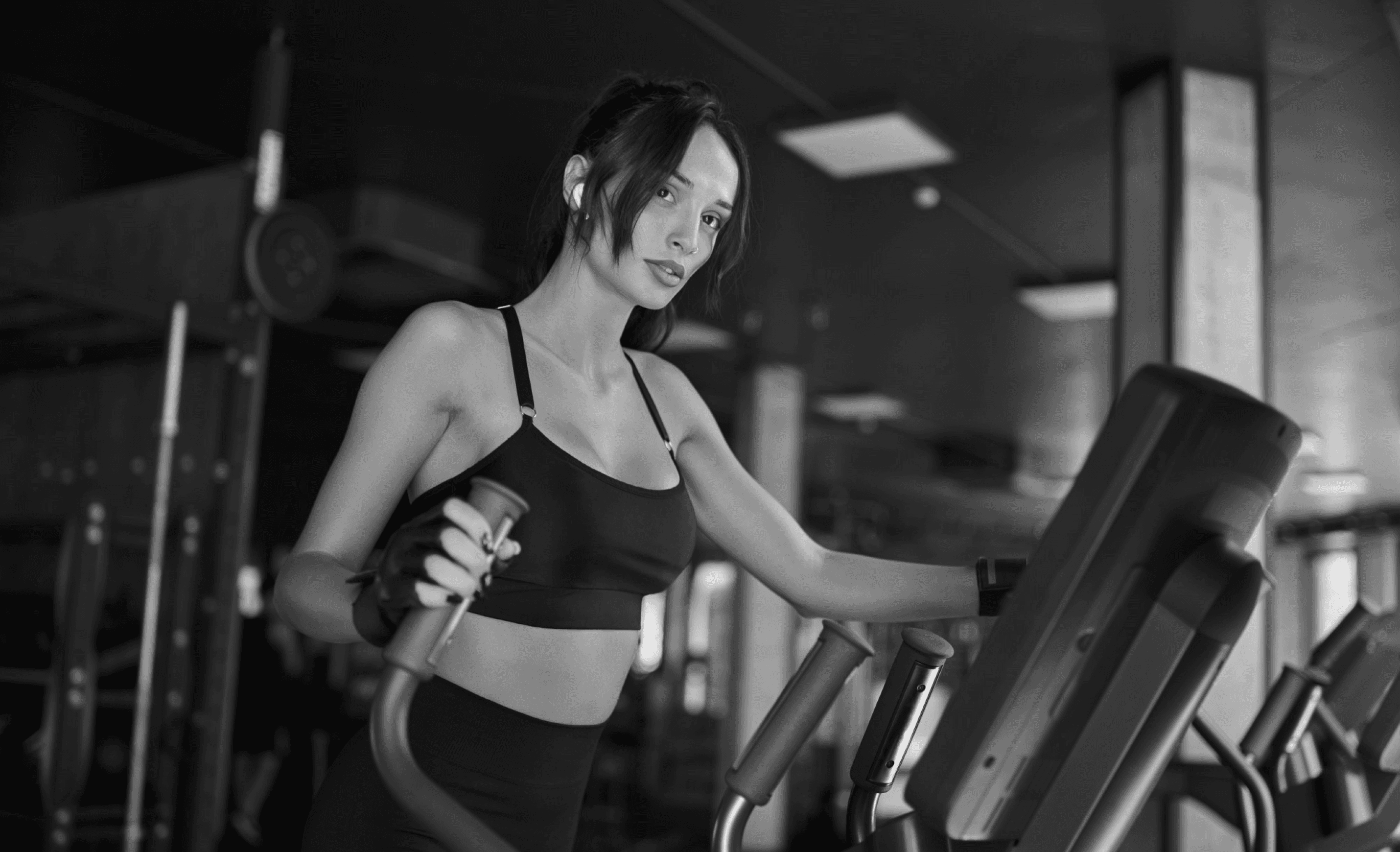 Fit woman jogging on treadmill during workout