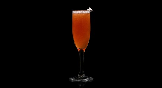 A closeup of a NEFT New Year drink against a dark background.
