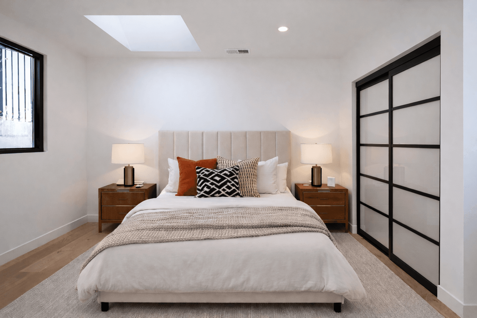 Dining area with red chairs and a view of the living room