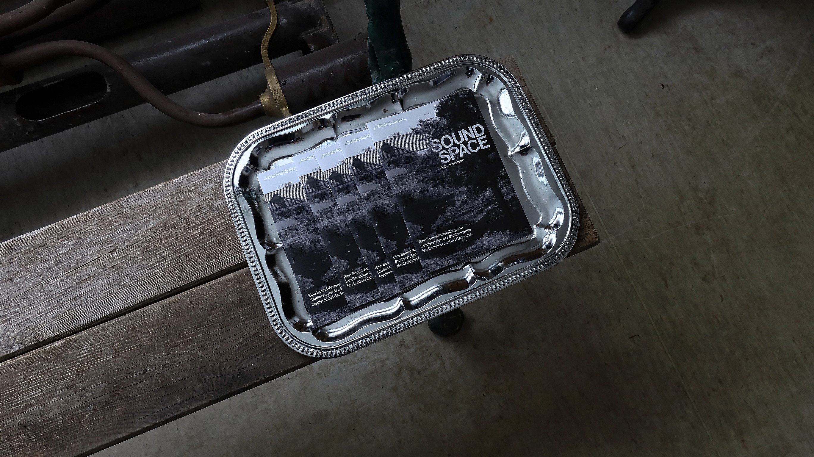 A modern laptop sits on a minimalist gray chair, displaying a website with bold typography reading "forma," showcasing an elegant editorial design layout in a sunlit interior space, reflecting the essence of contemporary brand identity systems and visual identity design for creative entrepreneurs.