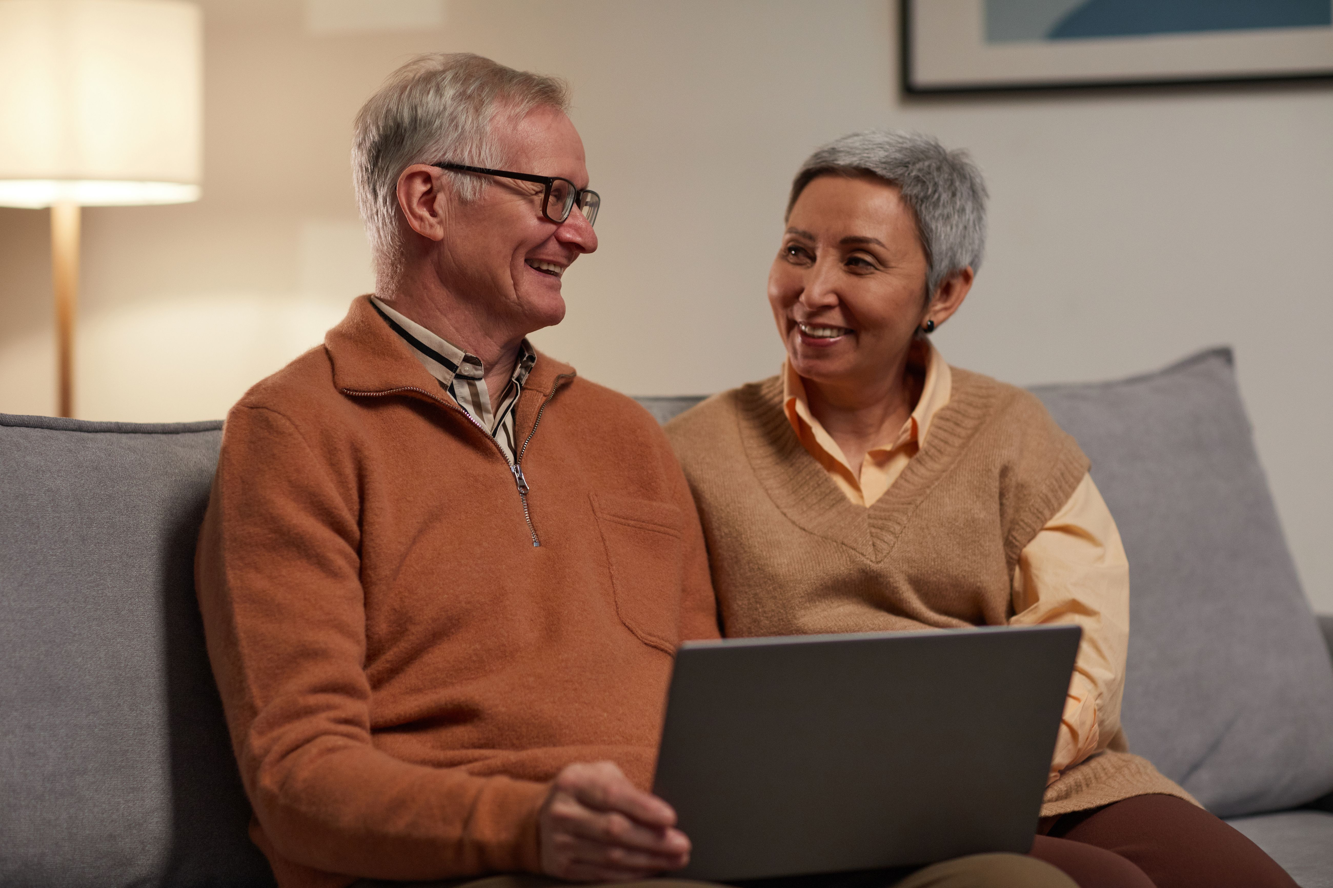 Mature couple having a serious conversation at home