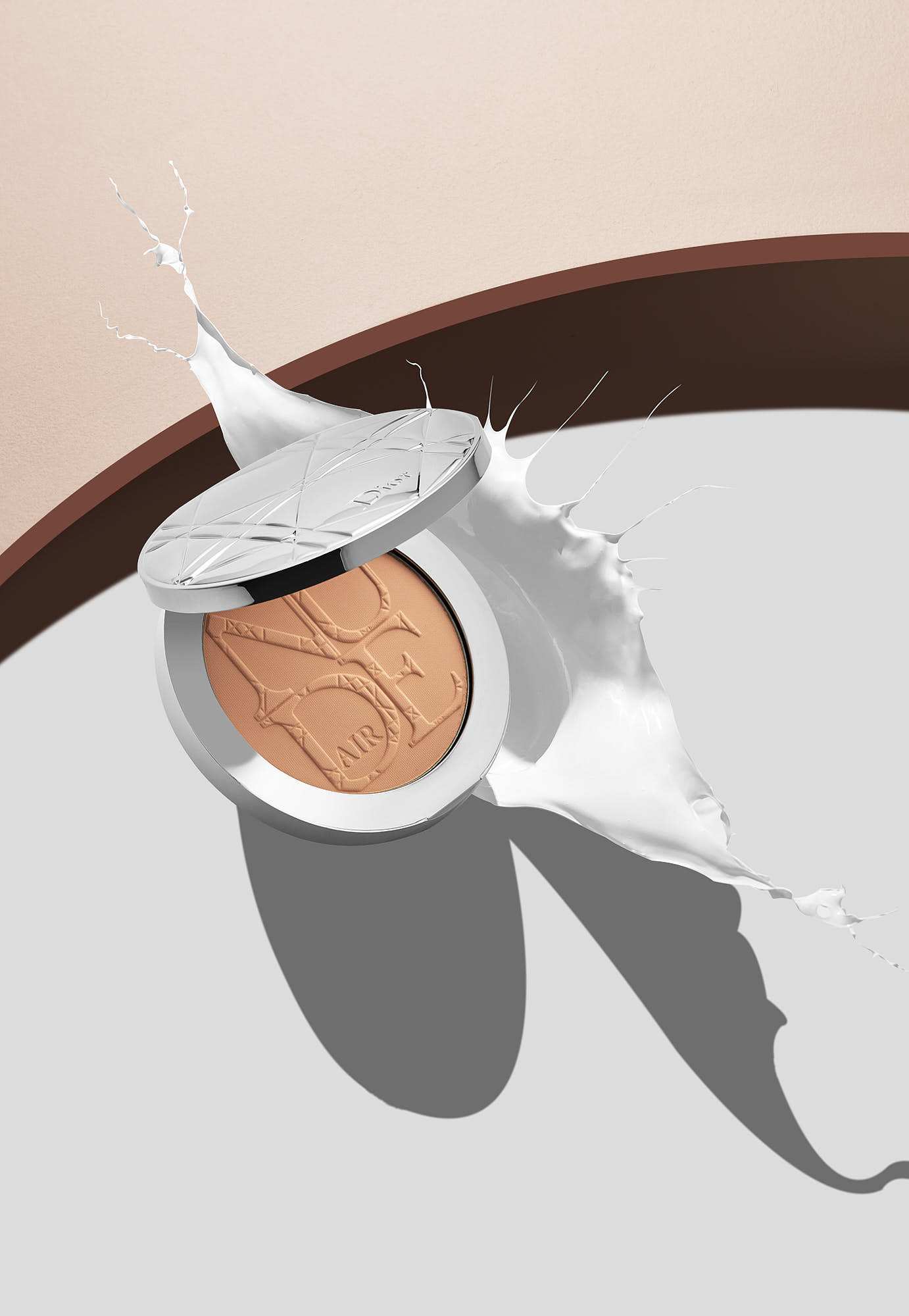 Luxury makeup compact with splash effect on minimalist background.