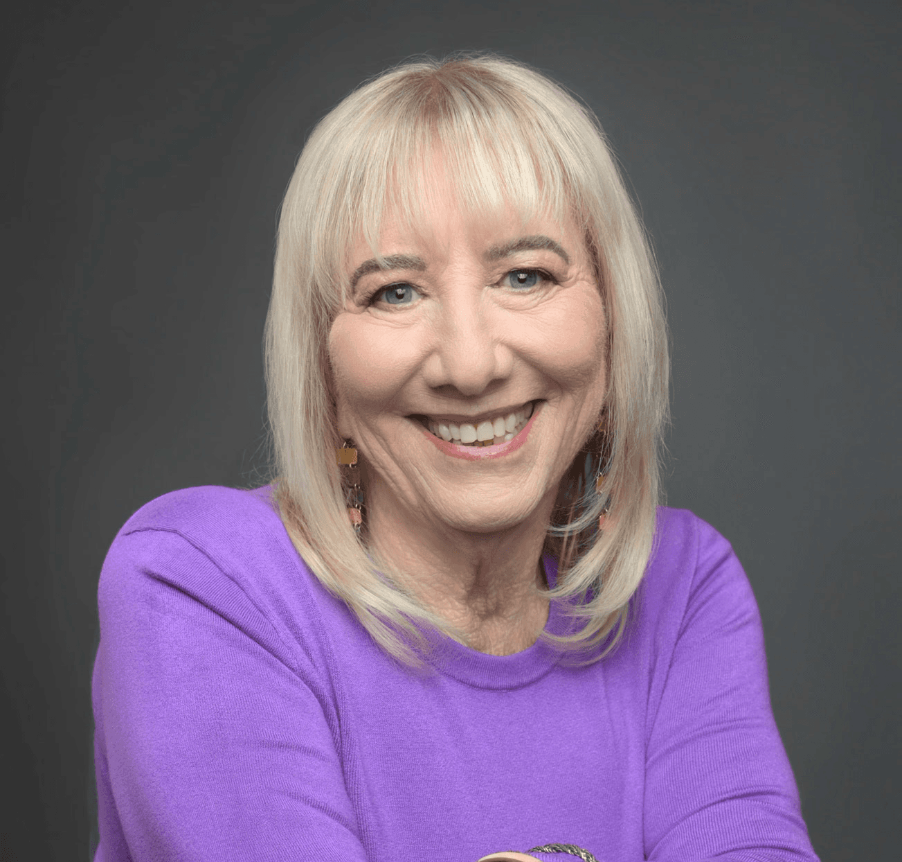 headshot of eileen in a purple sweater