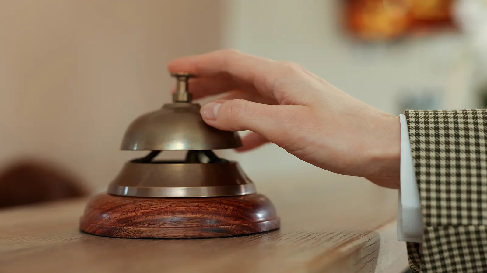 Woman pushing room service bell