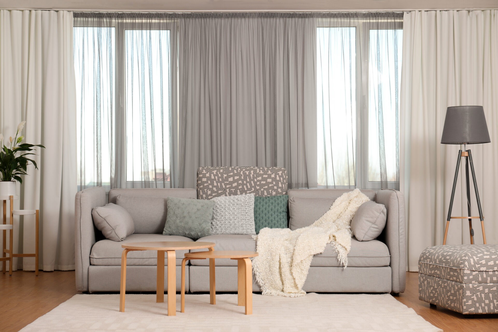 Window drapes in living room interior. Wholesale Blind Factory