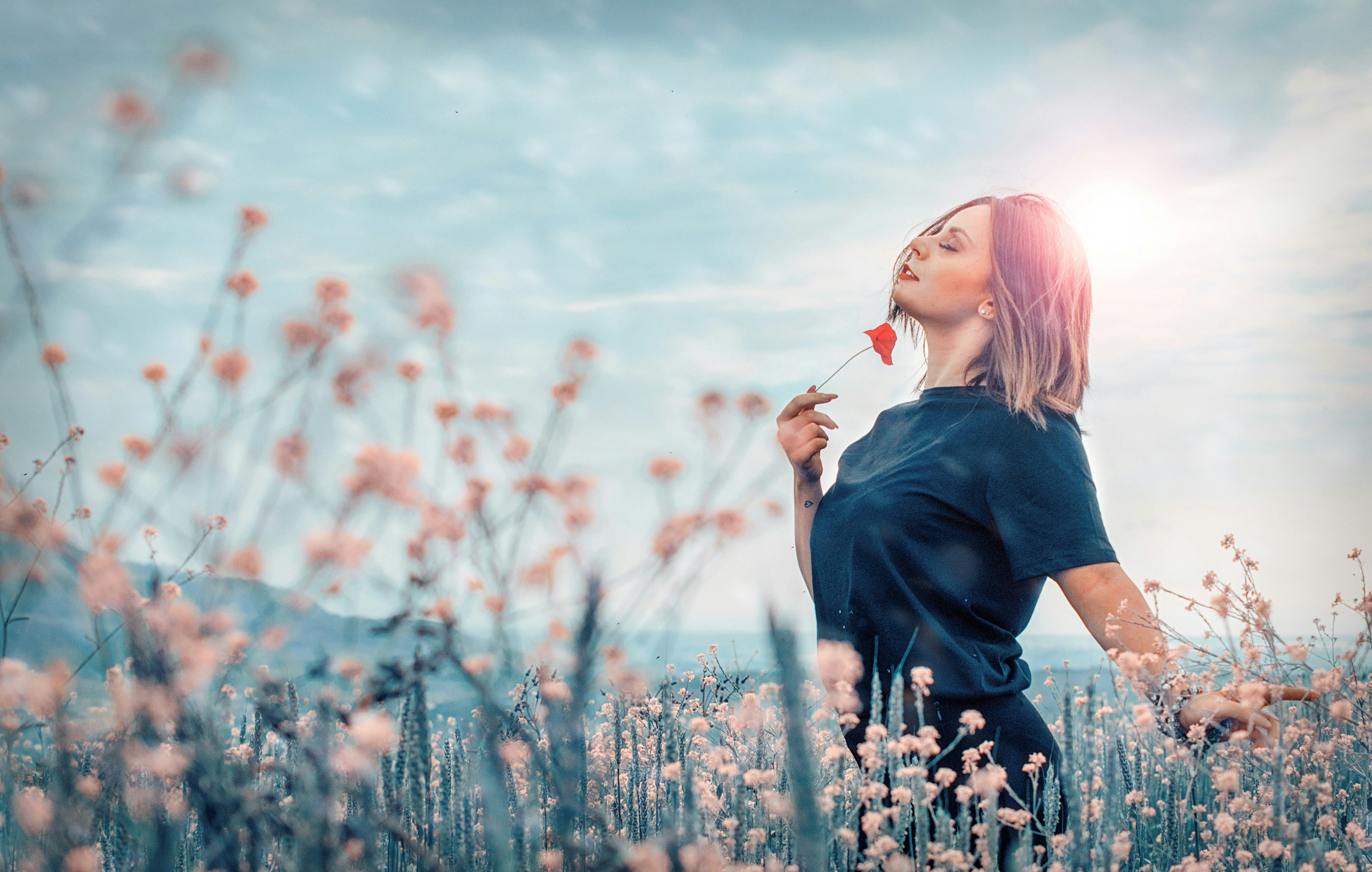 gorgeous woman in a field - How To Have A Glow Up Overnight