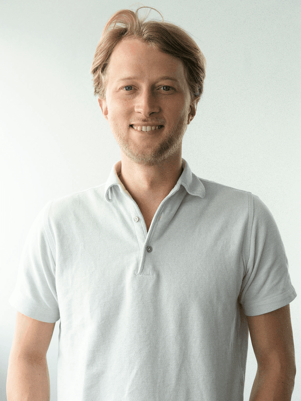 man standing beside wall