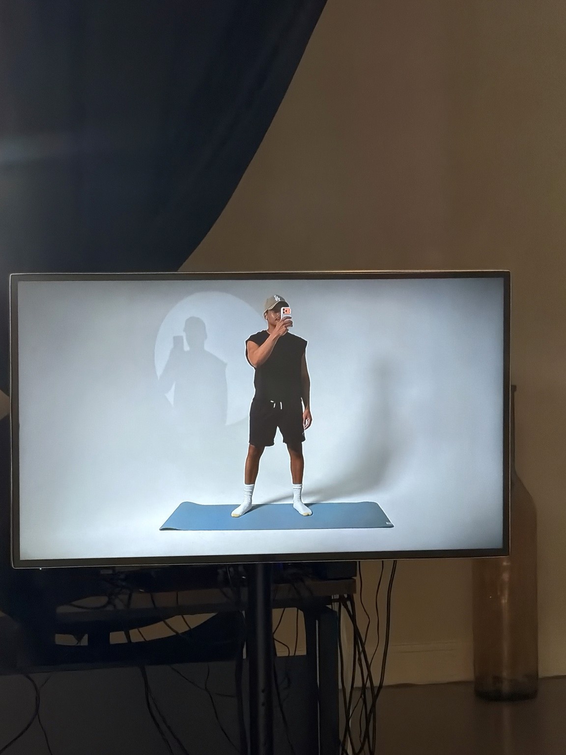 A fitness setup on the white backdrop, seen through the production monitor.