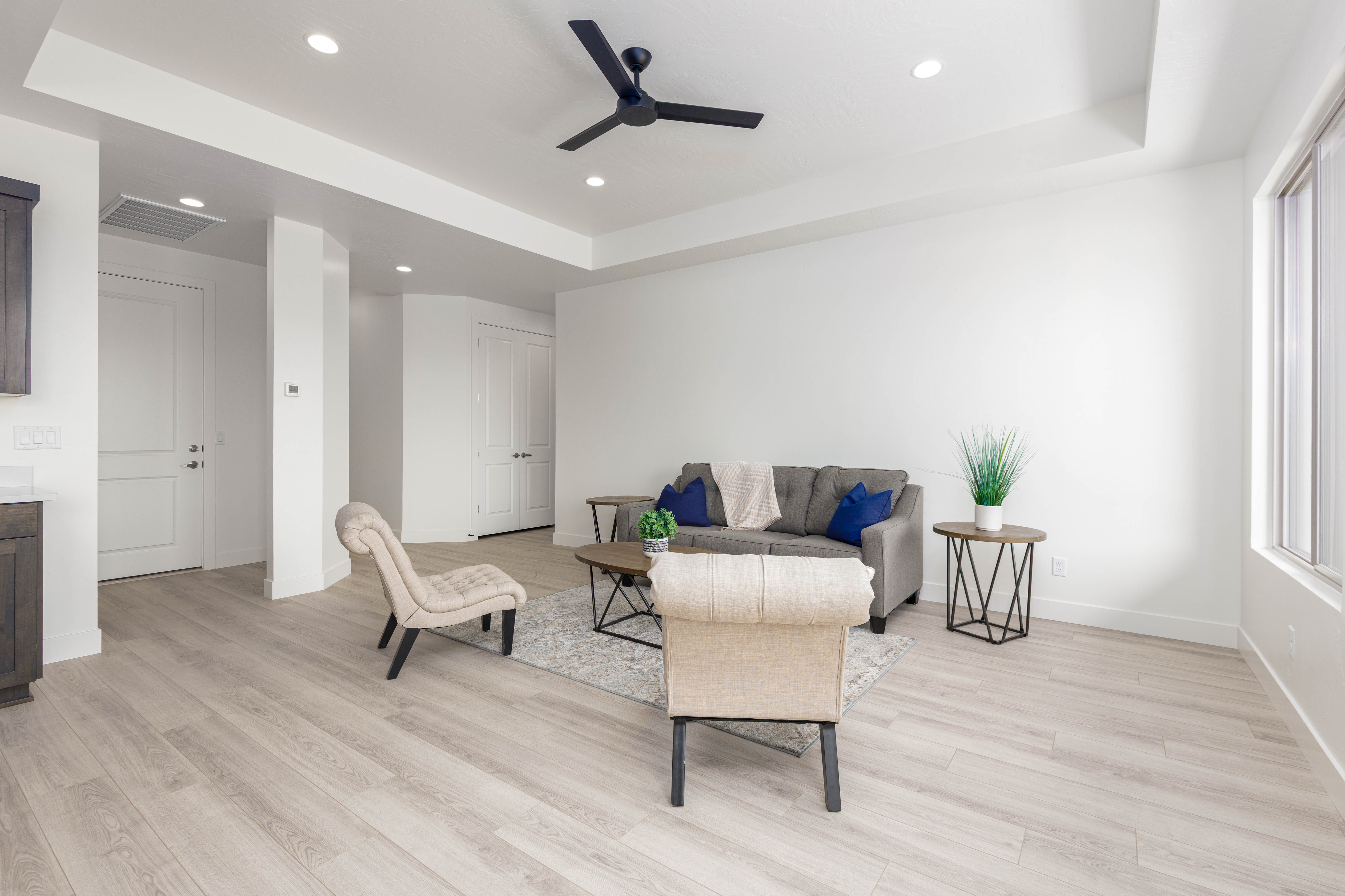 Spacious living room in The High Desert Home in Hurricane Utah with natural light and open layout.