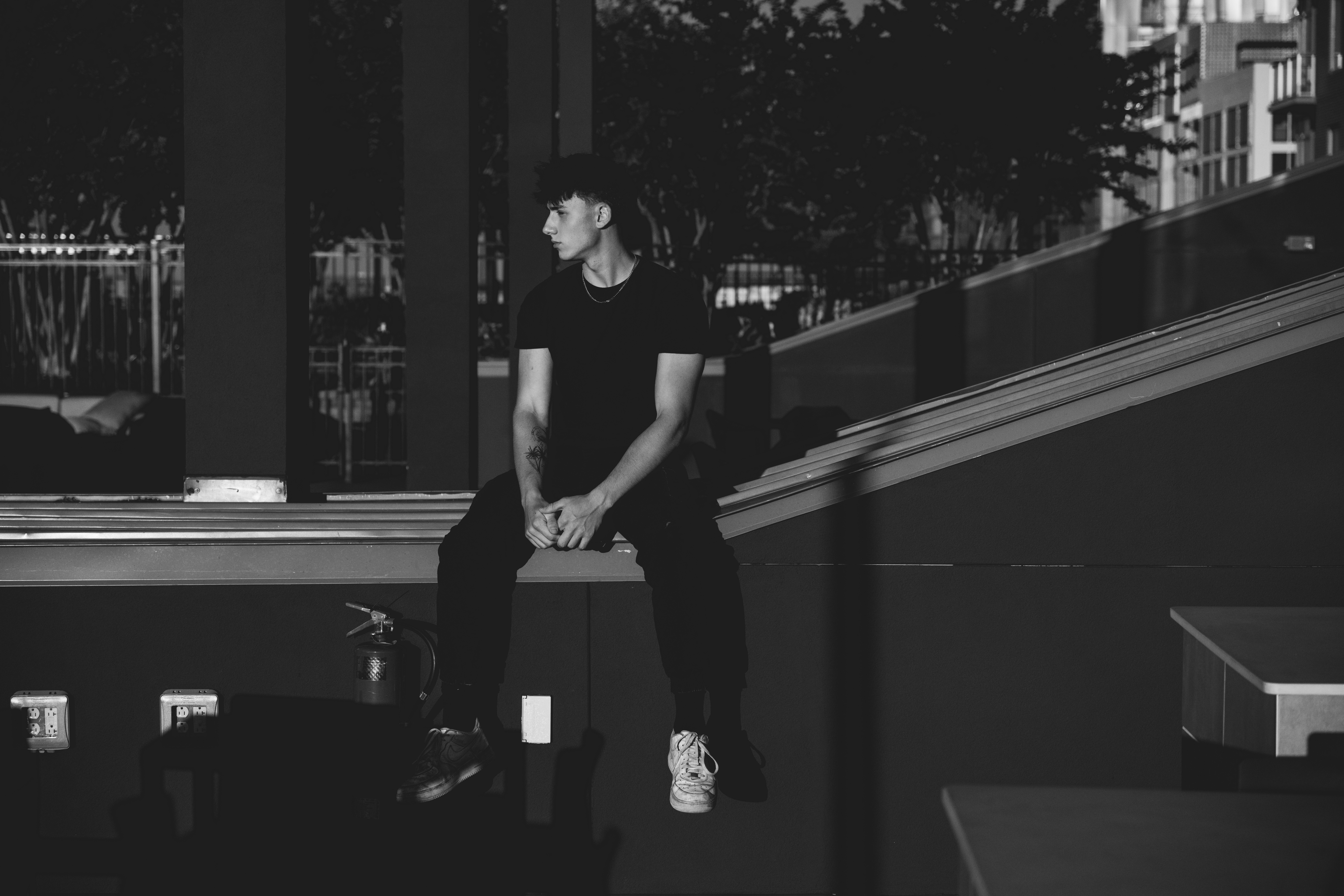 Ezra Urmy sitting down