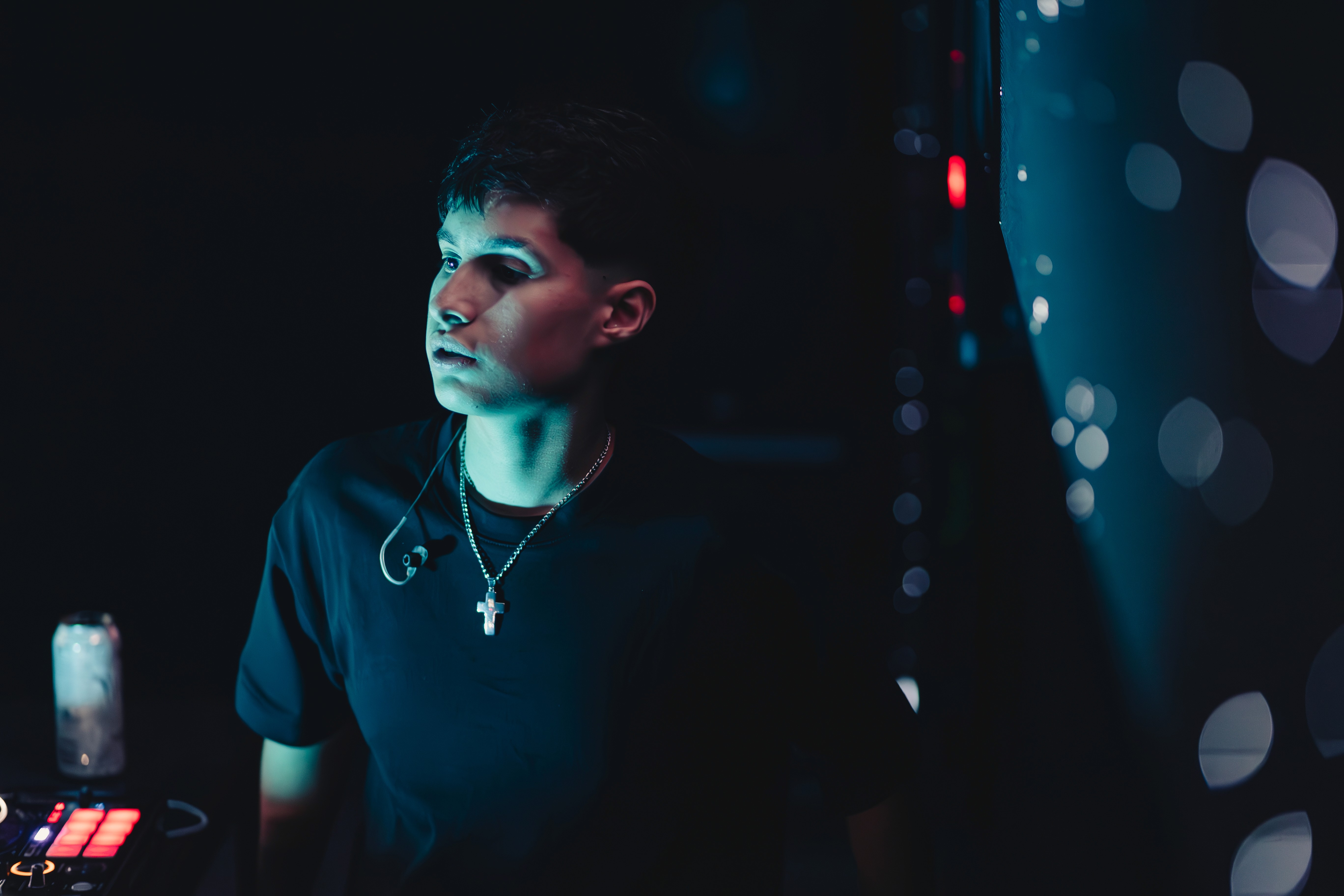 Rachel, personal trainer, looking to the side confidently in a fitness studio