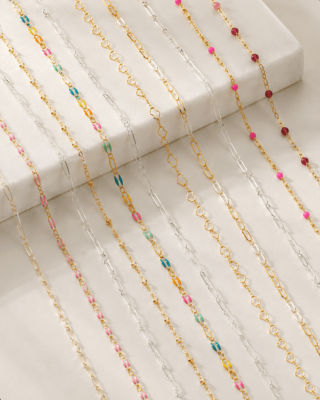 Gold-filled and silver chain styles laid out side by side