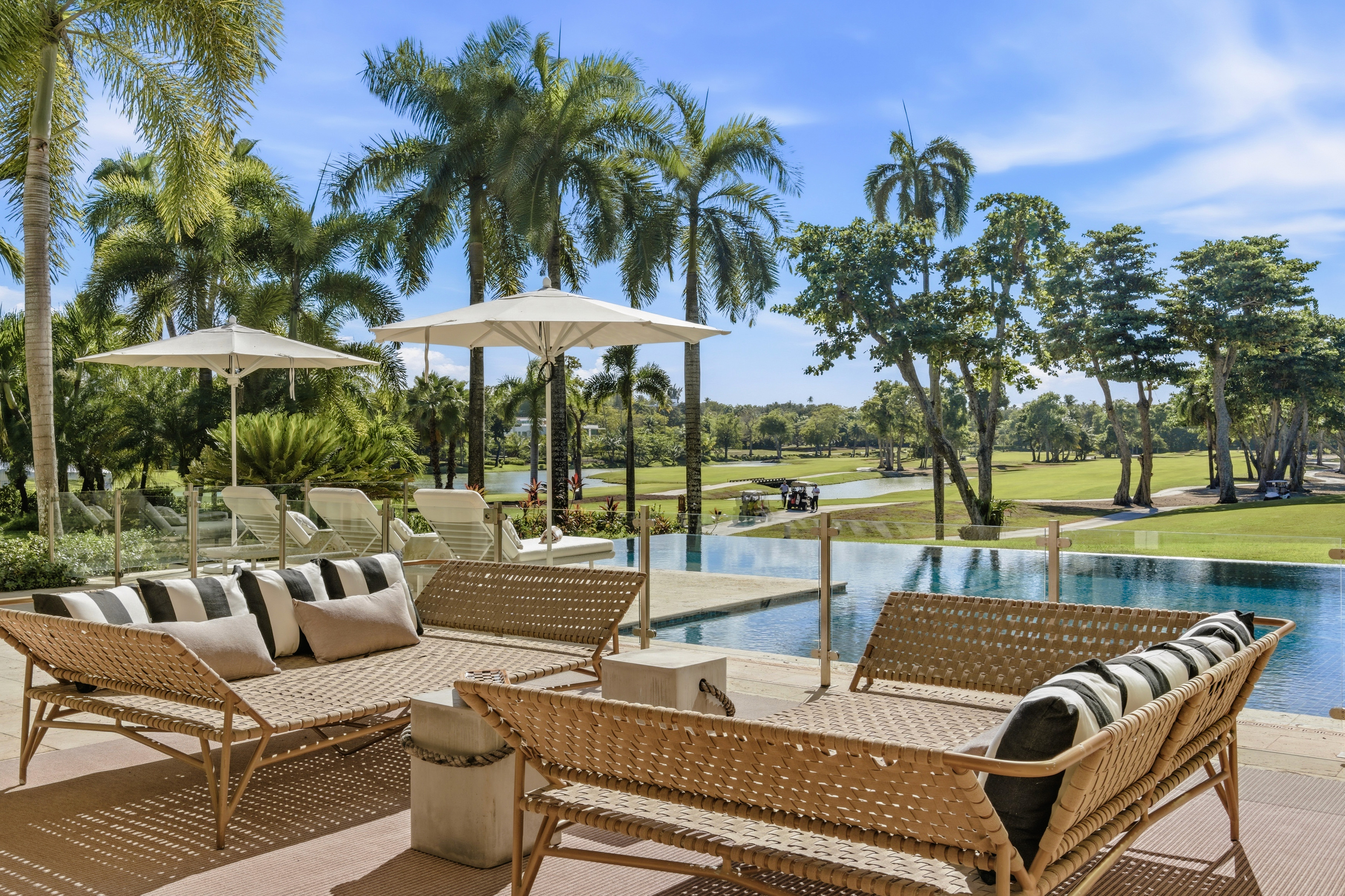 person sitting on grass and using phone