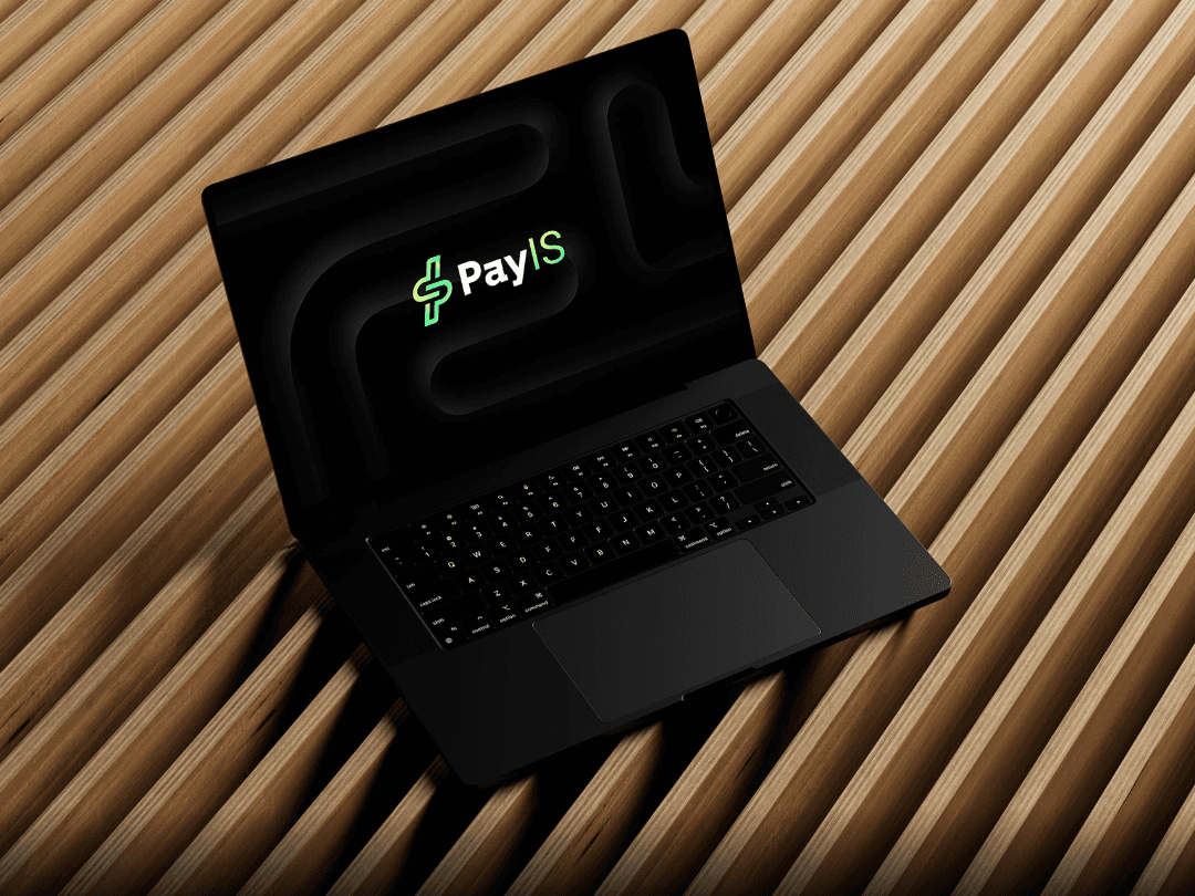 man wearing grey t-shirt standing in front of man sitting on chair