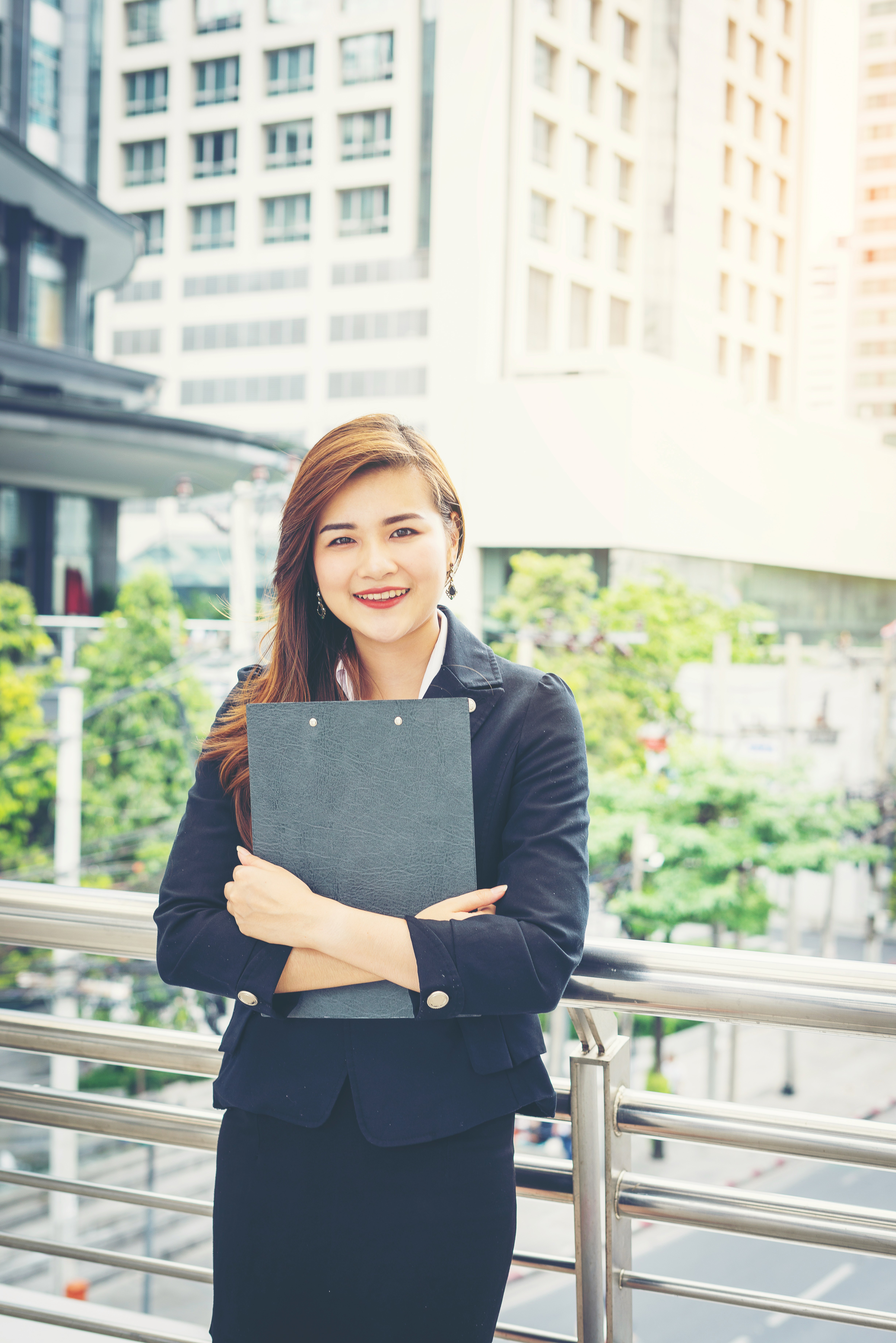 Black-and-white portrait of a middle-aged man with wavy hair and a light beard, giving a slight smile to the camera.