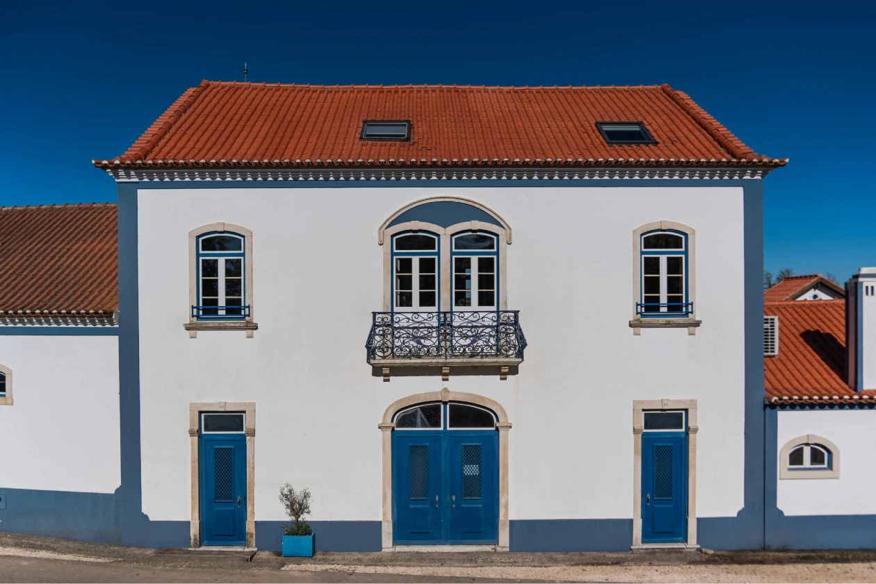 white and brown concrete building under blue sky during daytime
