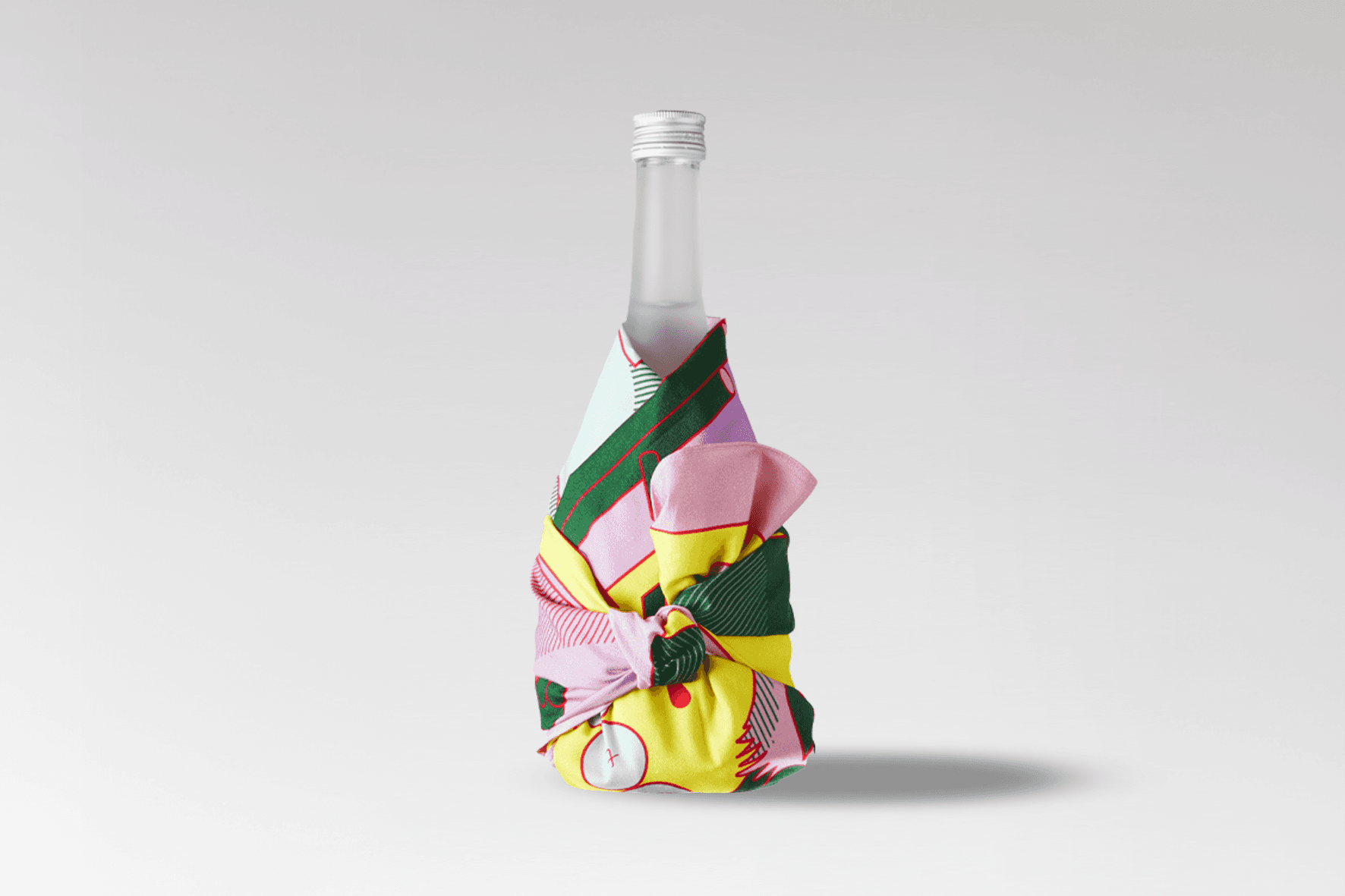 Bottle wrapped in the Wrap a Tale furoshiki design, showing another angle of the folklore-inspired illustration.