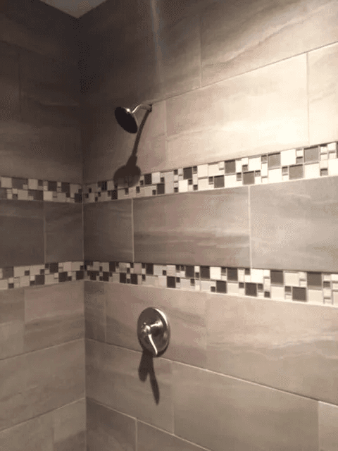 Elegant shower tile installation by Shilling's Carpets & Floors