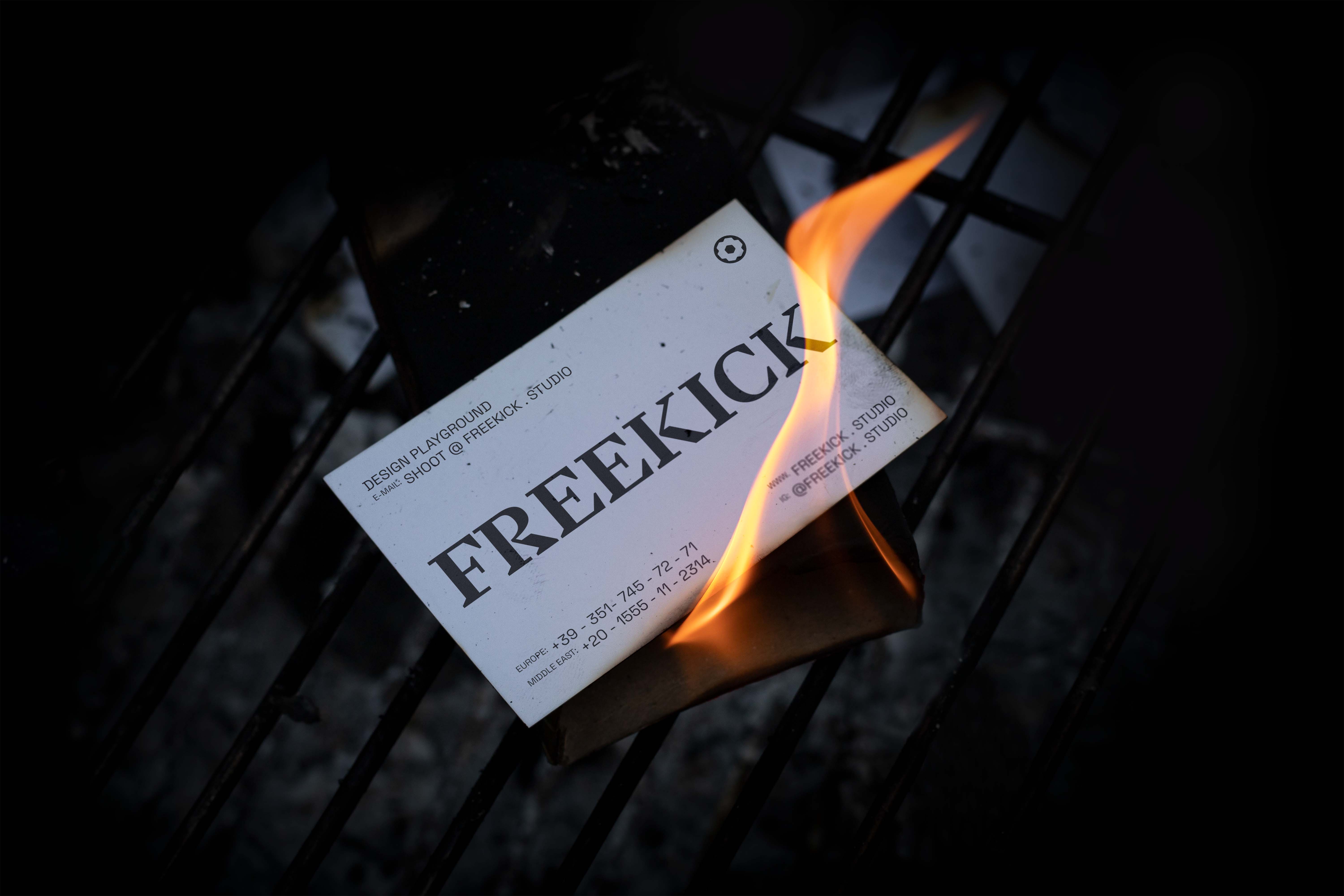 Black and white image of people working at a table with laptops, showing hands gesturing during discussion of digital content displayed on screens, with fabrica® logo in the corner.