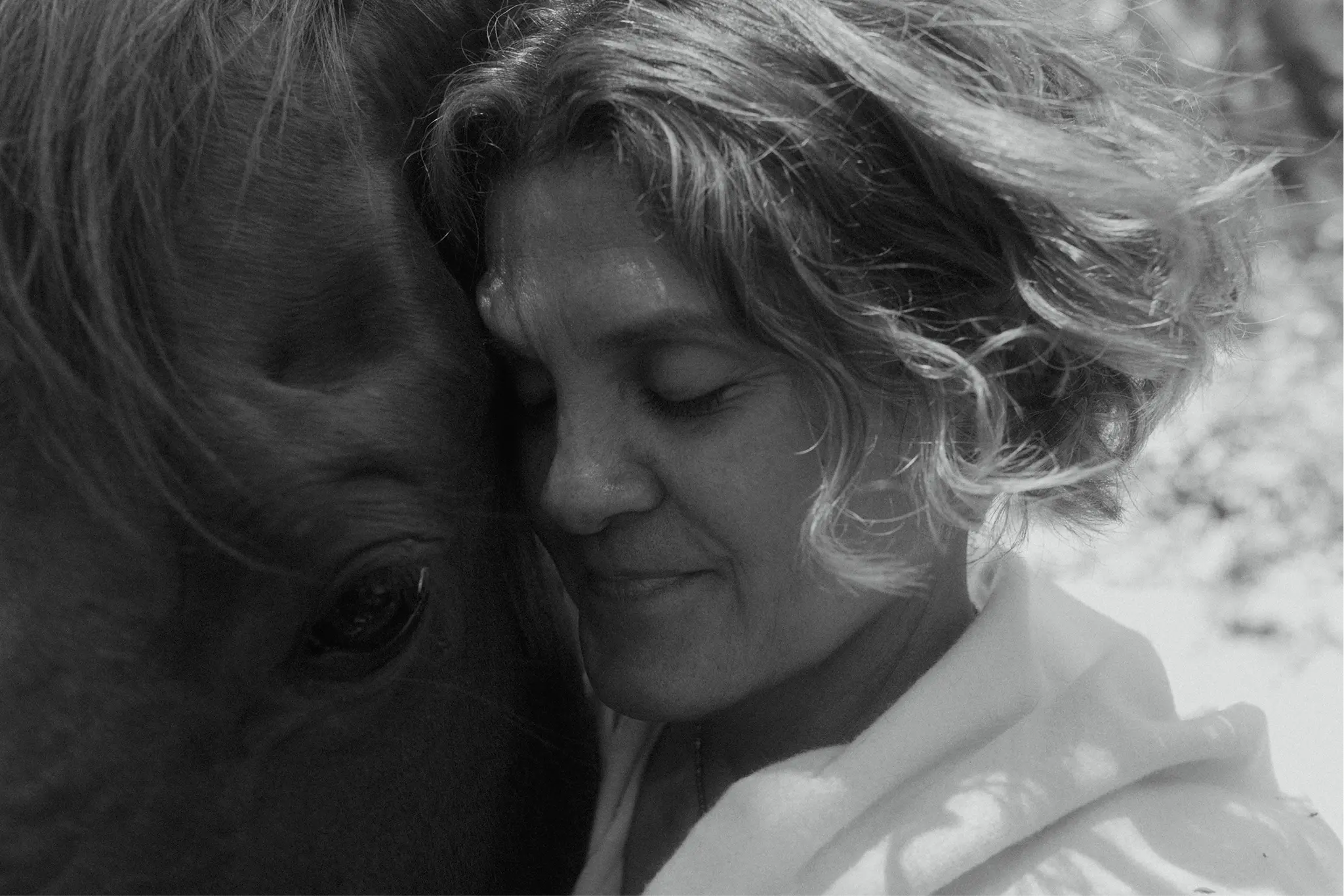 Sonia and Corona in a black and white close embrace representing cultivating respect and safety