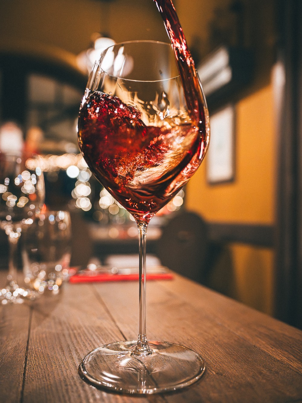 Herb-roasted chicken with baby potatoes and fresh rosemary on a dark plate.